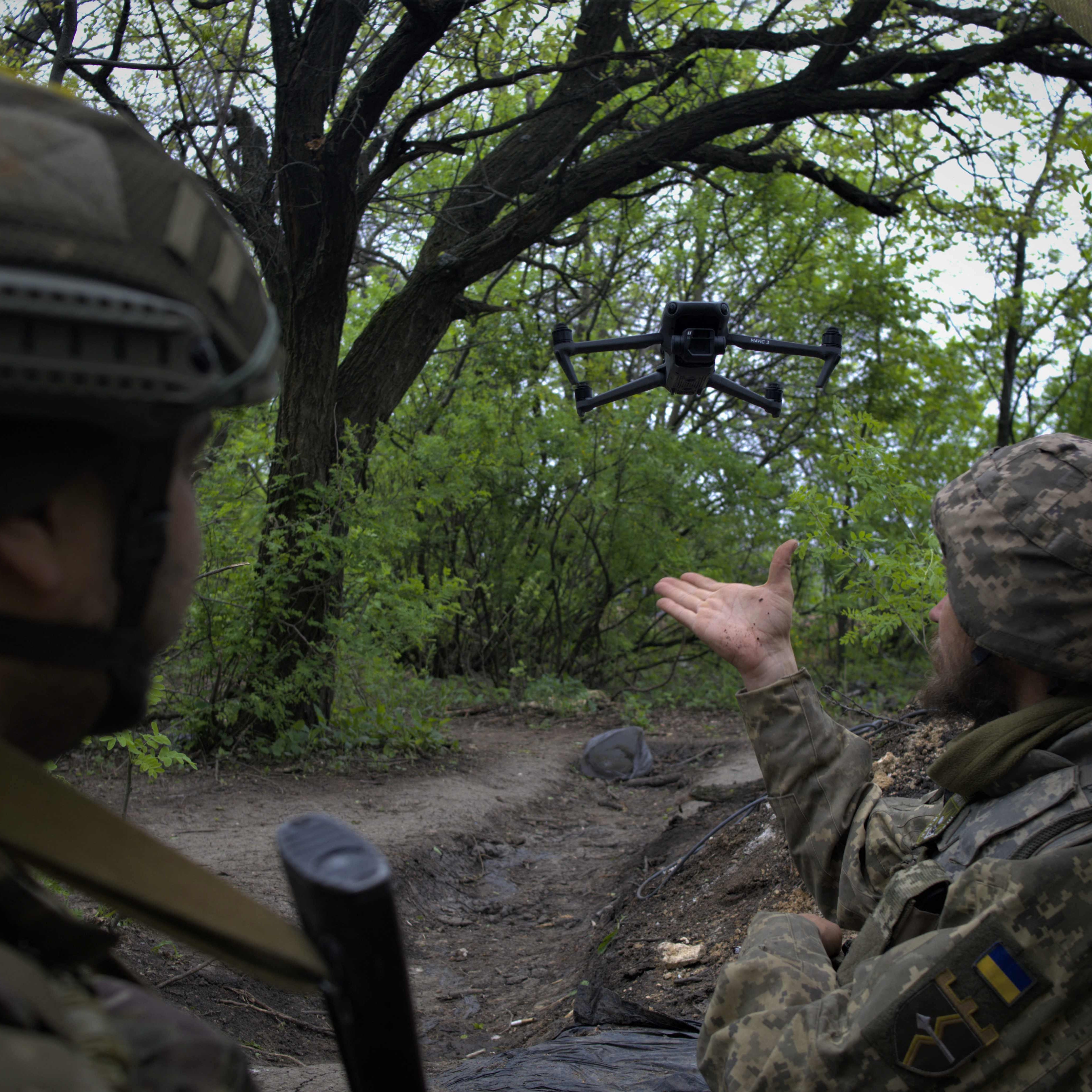 Ukrainian servicemen fly a drone at a front line near the town of Bakhmut, Donetsk region on May 8, 2023.