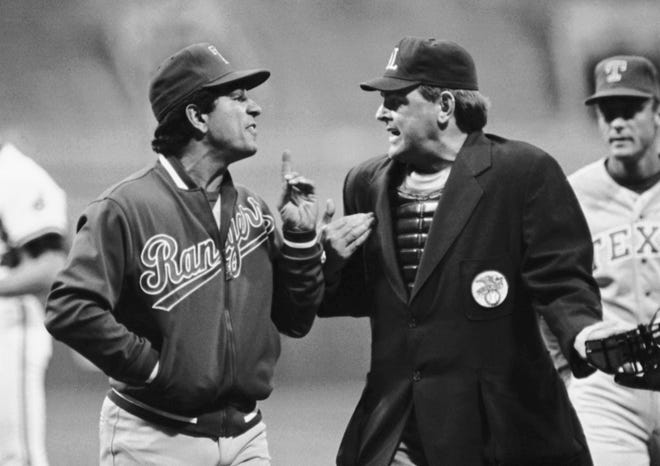 Don Denkinger, seen here arguing with Rangers manager Bobby Valentine during a 1986 game, has died, MLB announced. Denkinger was 86.
