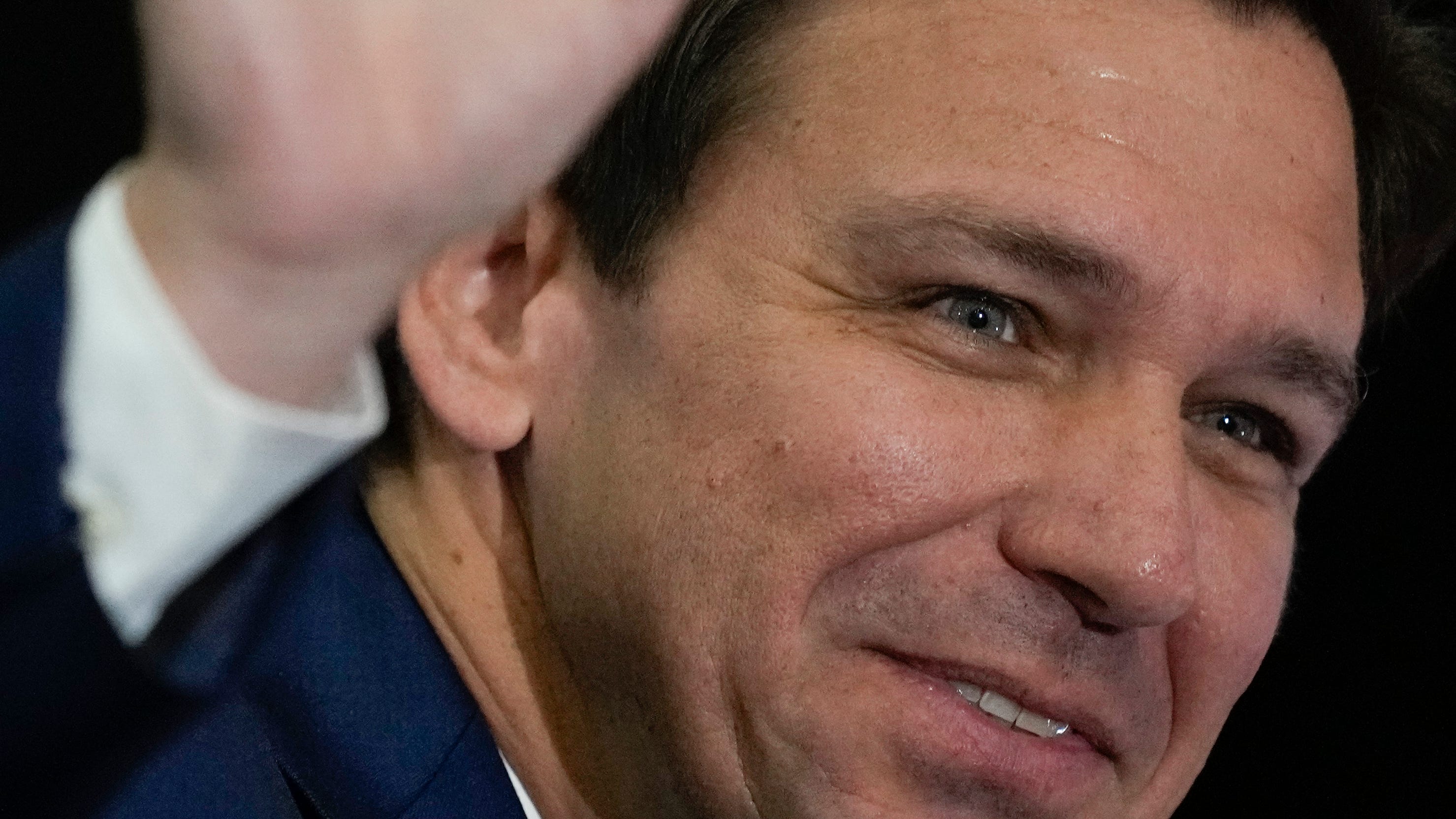 Florida Governor Ron DeSantis waves as he arrives for a press conference to sign several bills related to public education and teacher pay, in Miami, Tuesday, May 9, 2023.