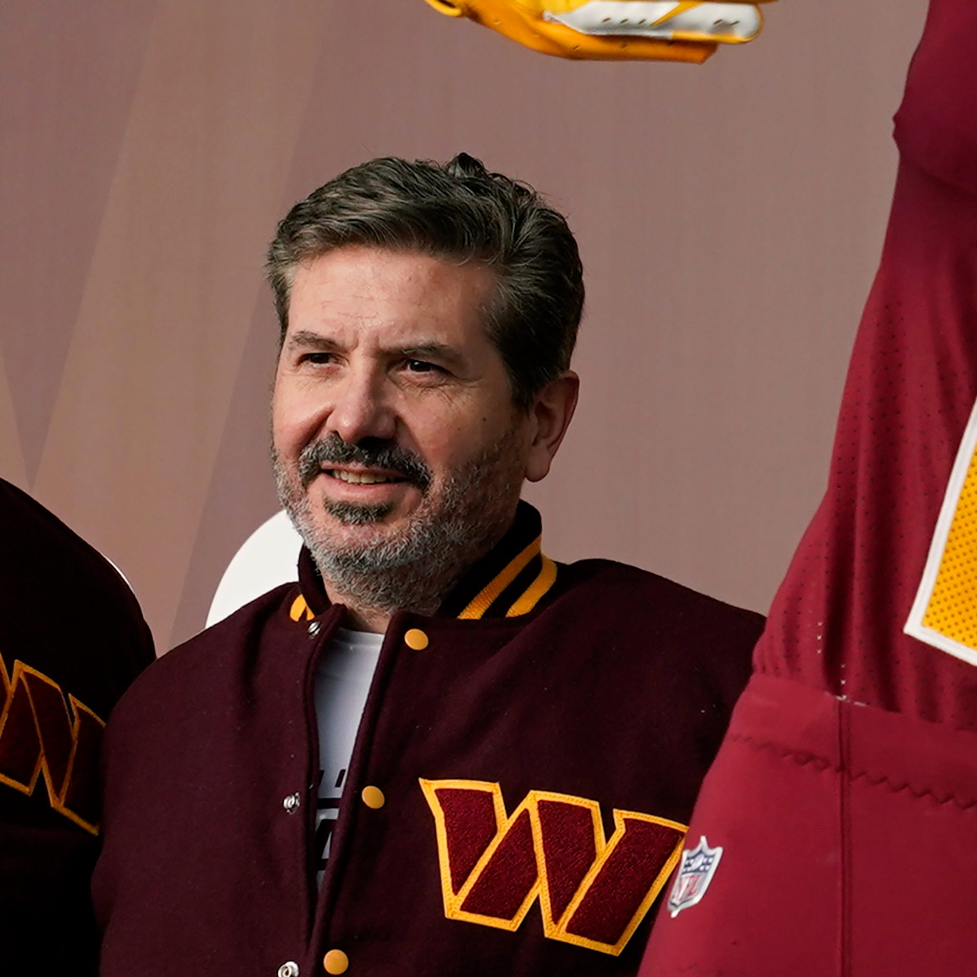 Washington Commanders' Dan Snyder poses for photos during an event to unveil the NFL football team's new identity, Feb. 2, 2022, in Landover, Md.