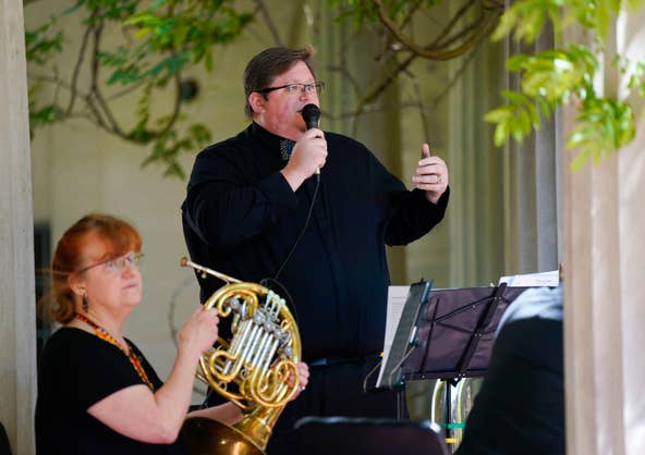 Derek Fenstermacher of the New Jersey Symphony Chamber Players speaks during the Mother's Day concert at the Van Vleck House and Gardens in Montclair on Sunday, May 14, 2023.