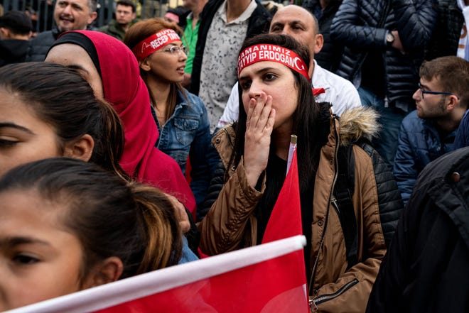 Supporters of Turkey’s leader Recep Tayyip Erdogan   wait for election results in Istanbul on May 14, 2023.