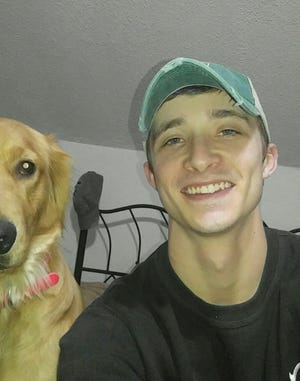 Kevin Hartley with his dog, Chevelle. He died at 21 in 2017 while refinishing a bathtub with a methylene chloride product.