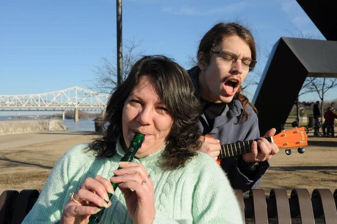 Lauren Atkins and her son, Joshua, play around at a park in Louisville, Kentucky, in 2011. Joshua, an avid BMX biker who loved outdoors activities, music and photography, died at 31 in 2018 while refinishing his bike with paint stripper.