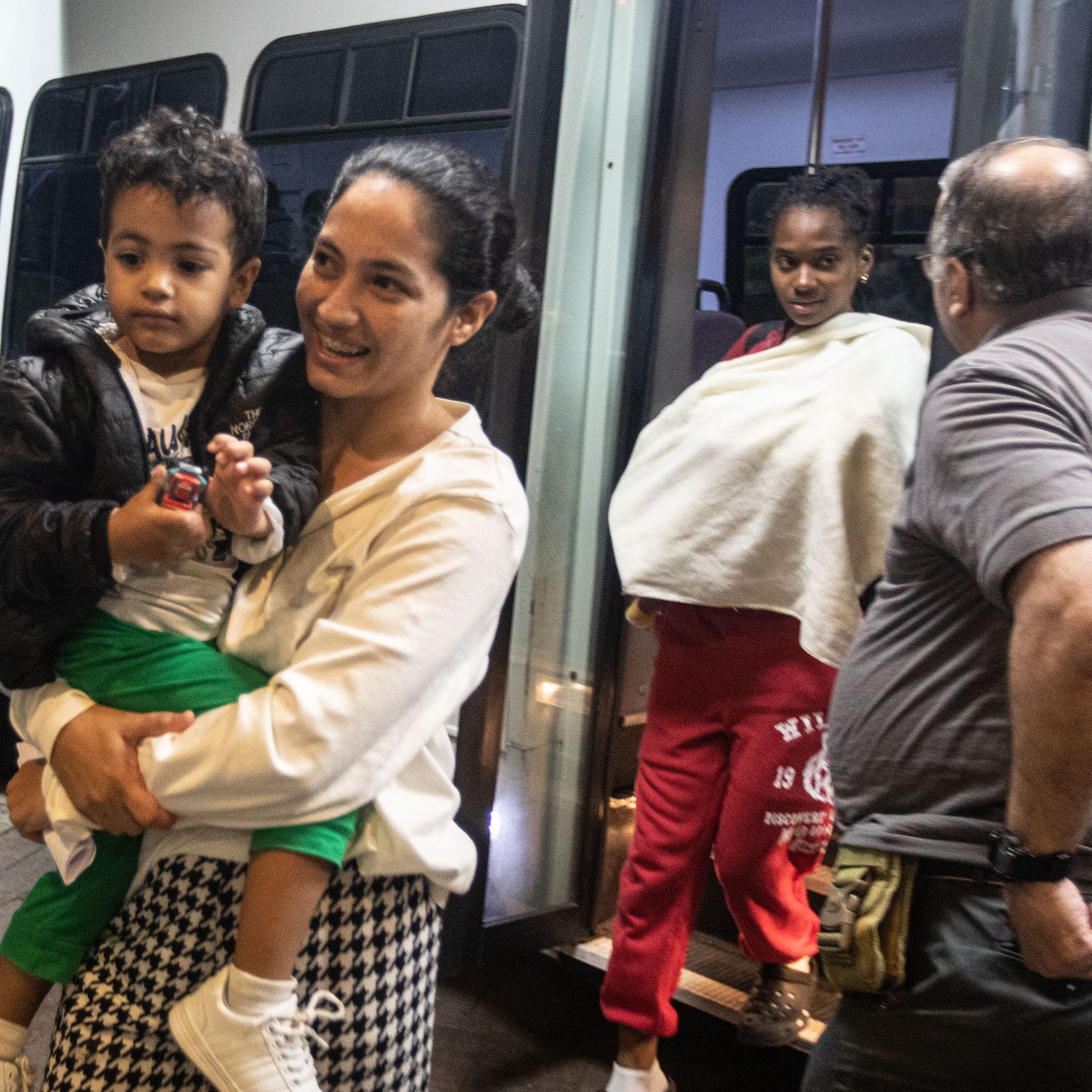 Families of asylum seekers are led into the Ramada hotel in Yonkers onkers May 15, 2023. The families were being housed in New York City.