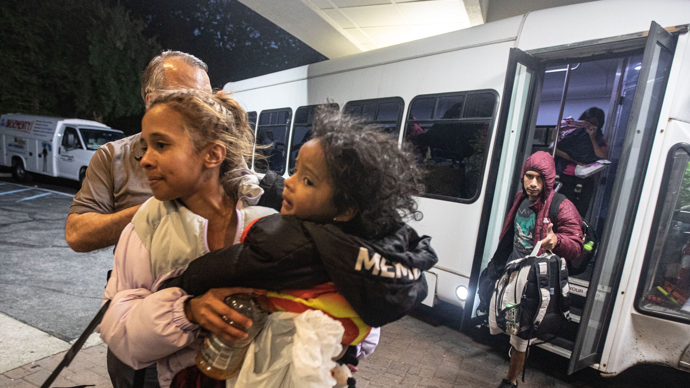 Families of asylum seekers are led into the Ramada hotel in Yonkers onkers May 15, 2023. The families were being housed in New York City.