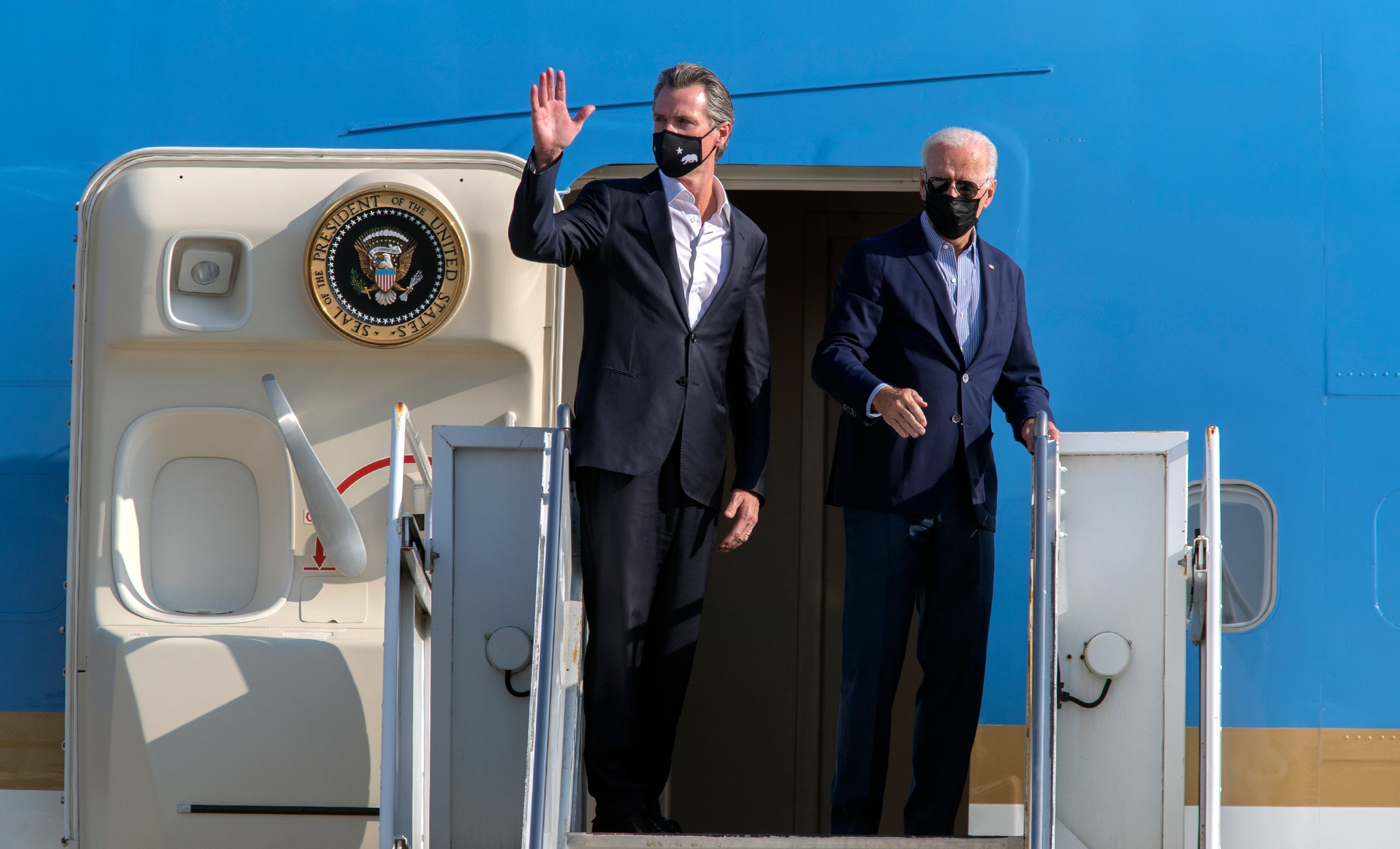 California Gov. Gavin Newsom, left, and President Joe Biden board Air Force One on a visit to Sacramento on Sept., 13, 2021.