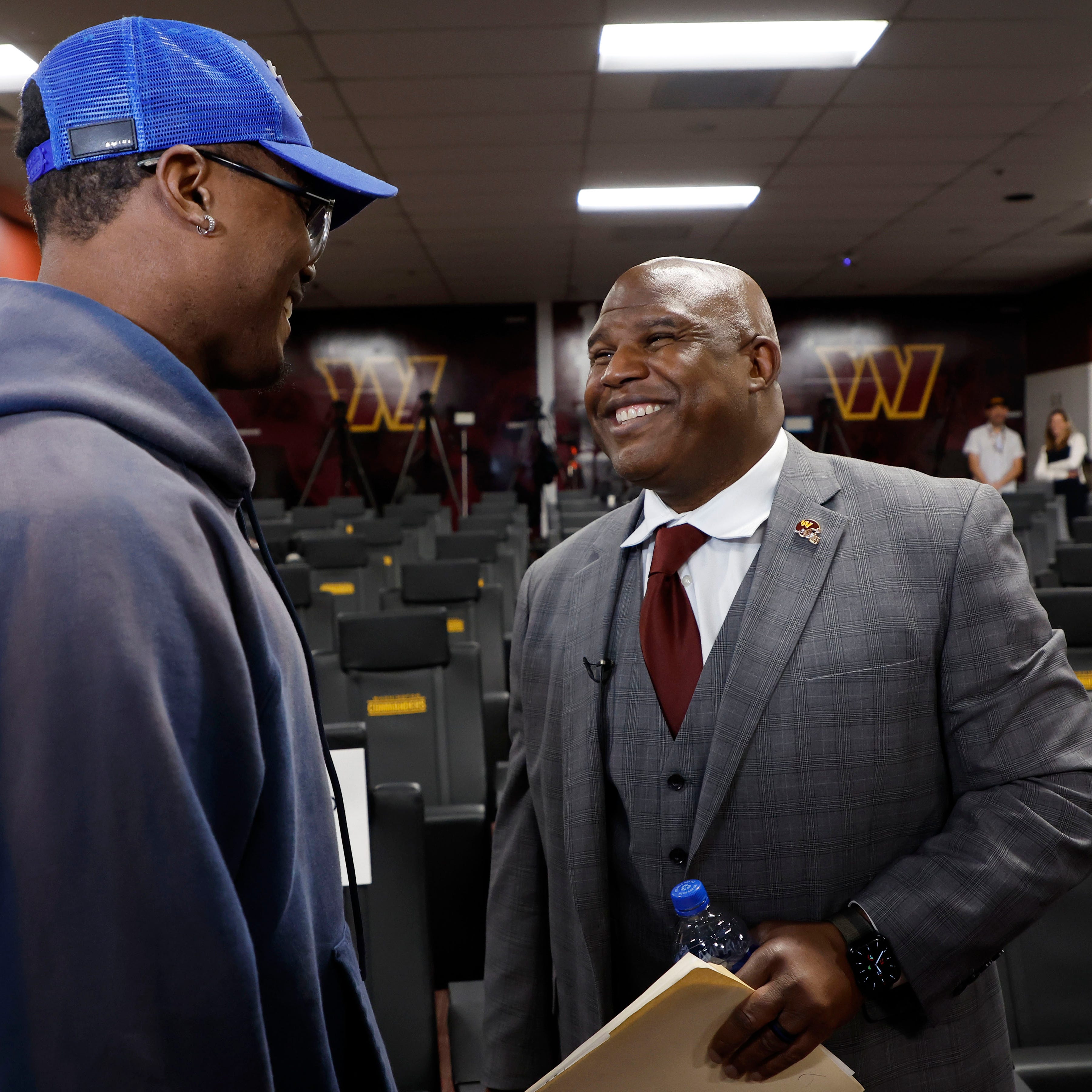 Eric Bieniemy talks with Washington wide receiver Terry McLaurin after being introduced as the new Commanders offensive coordinator.