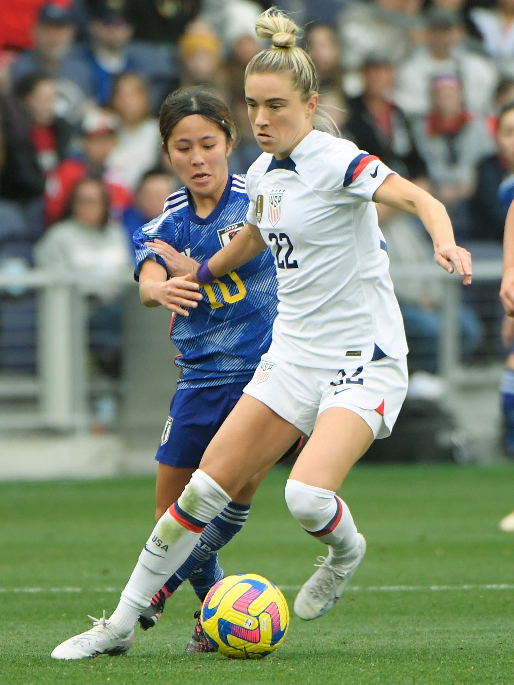 An action image of Kristie Mewis playing soccer.