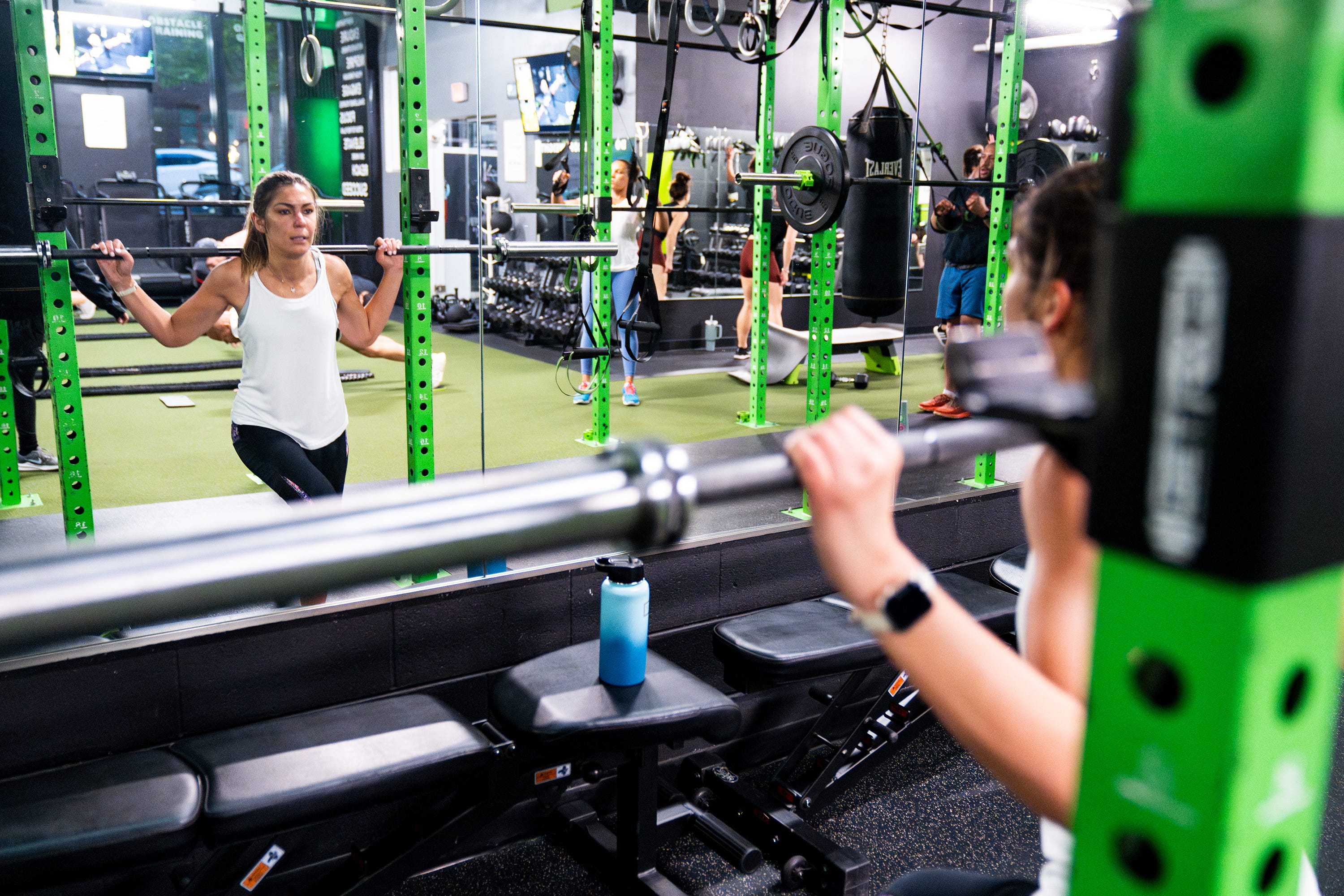 April 21, 2023; Alexandria, VA, USA; Daisy Andonyadis, a third grade teacher at Cora Kelly School, works out at E60 Fitness in Arlington before work Friday, April 21, 2023.. Mandatory Credit: Josh Morgan-USA TODAY [Via MerlinFTP Drop]