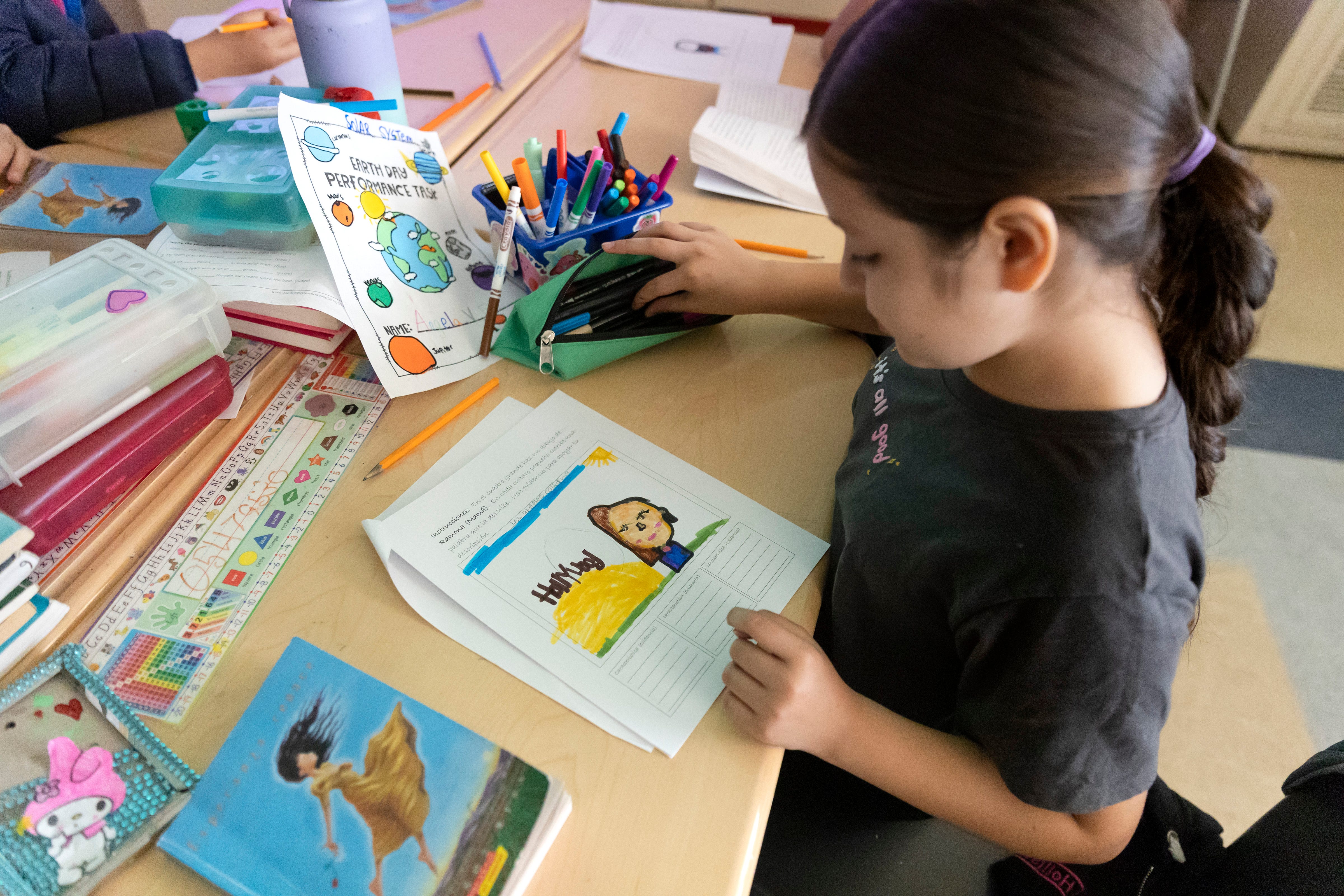 Valeria Escobedo Martinez works on a project during class at Downer Elementary in San Pablo, Calif.