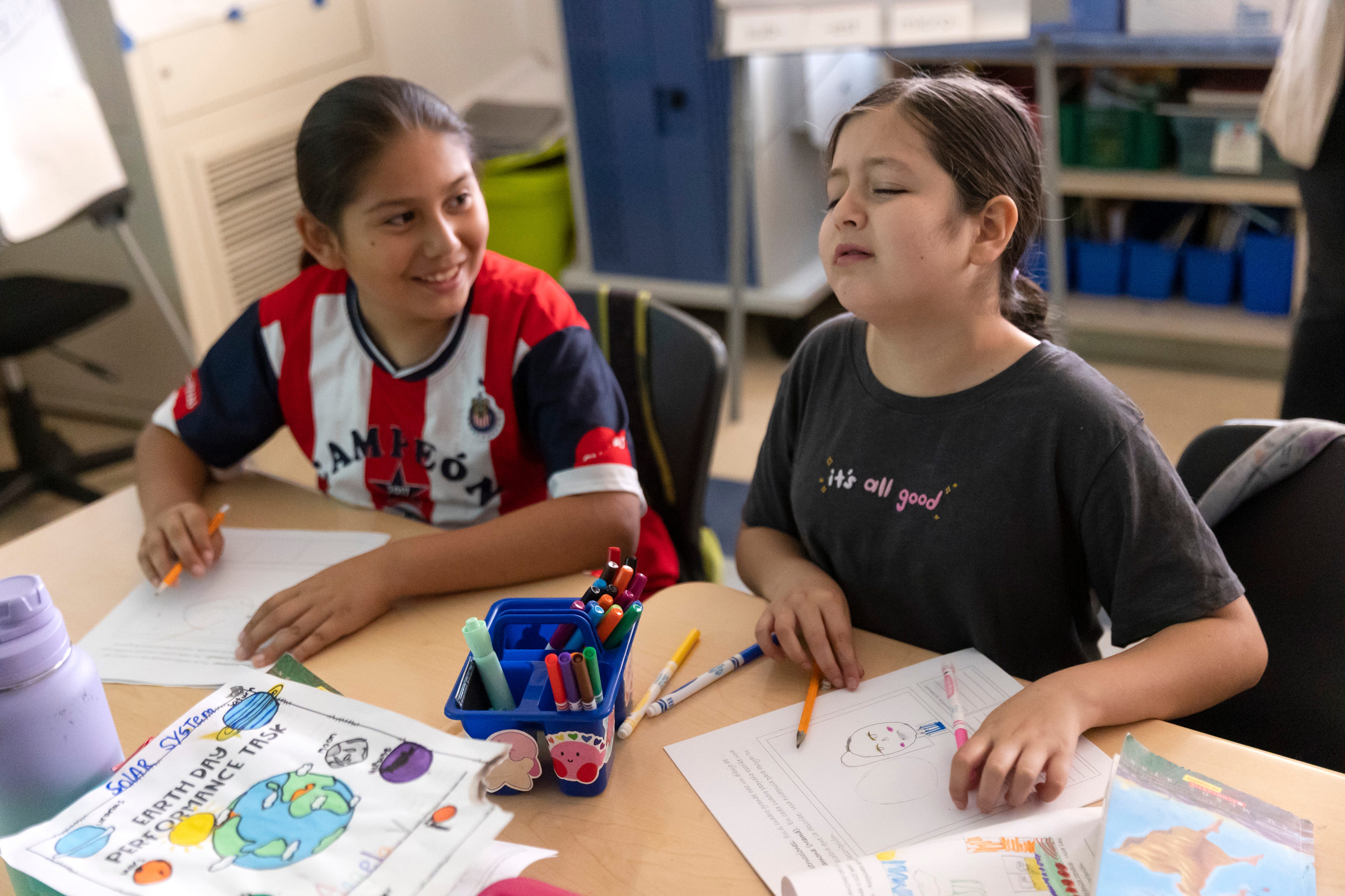 Valeria Escobedo Martinez (right) and Erick Ucelo Bustos, fourth grade students in Wendy Gonzalez's class, work on a project at Downer Elementary, San Pablo, Calif.