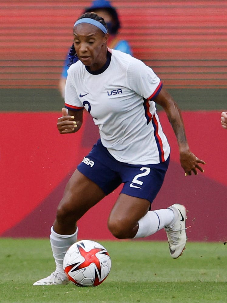 An action image of Crystal Dunn playing soccer.
