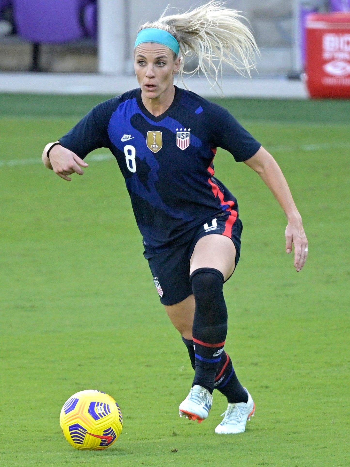 An action image of Julie Ertz playing soccer.