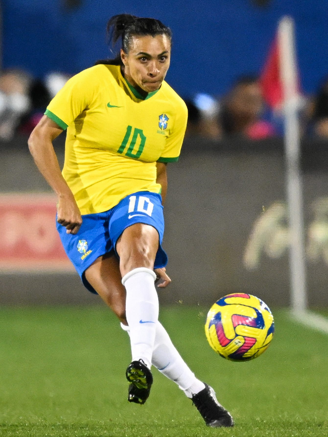 An action image of Marta playing soccer.