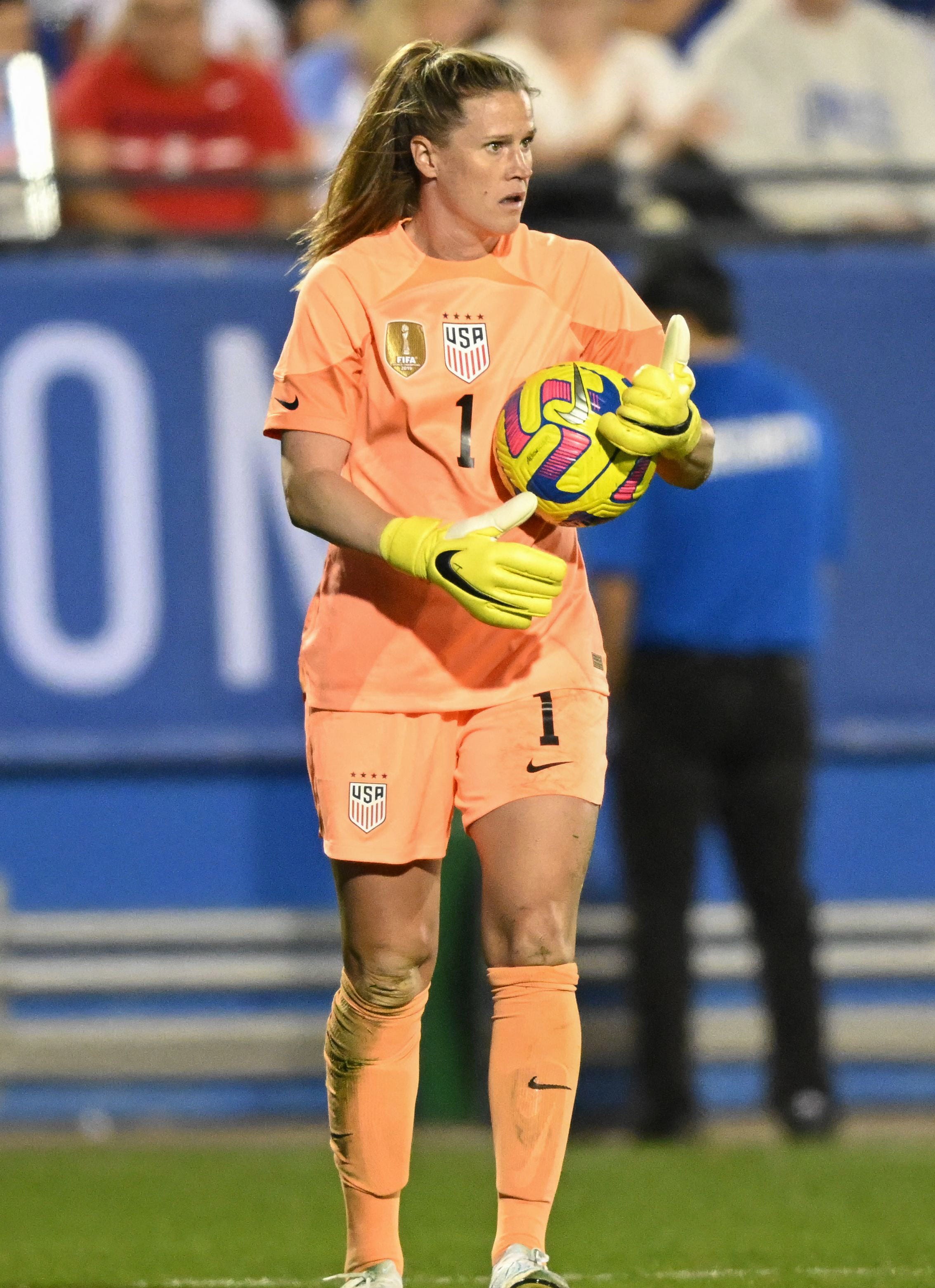 An action image of Alyssa Naeher playing soccer.