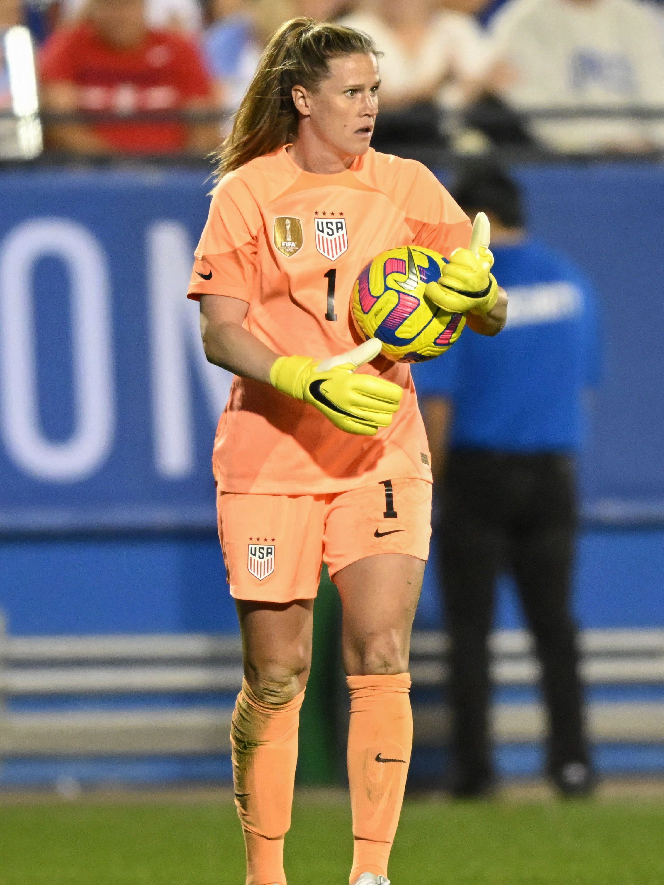 An action image of Alyssa Naeher playing soccer.