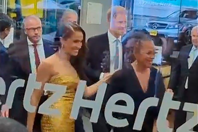 Prince Harry, center right, and his wife Meghan Markle, center left, arrive at the event venue prior to their car incident in New York on May 16, 2023.