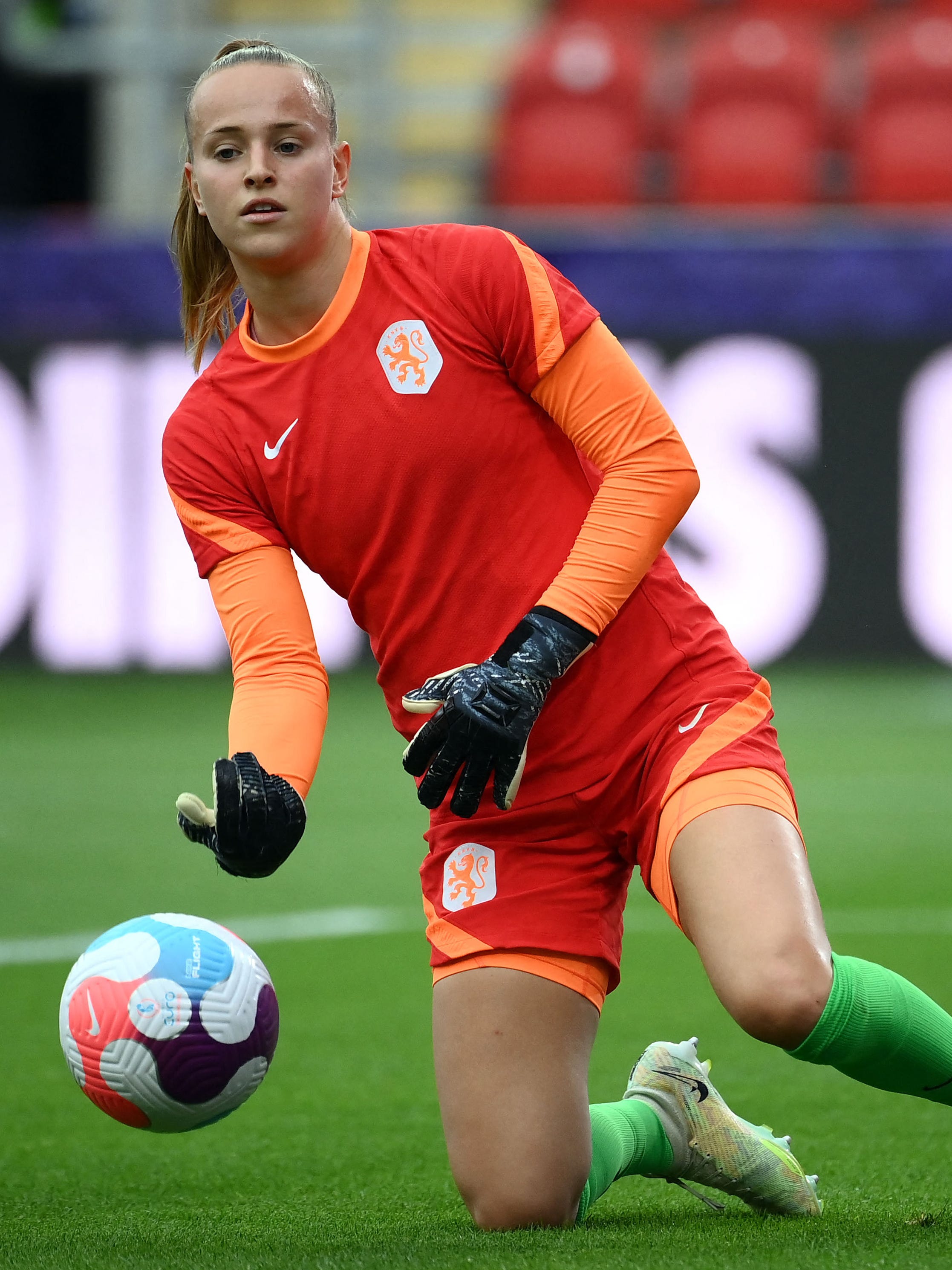 An action image of Daphne van Domselaar playing soccer.