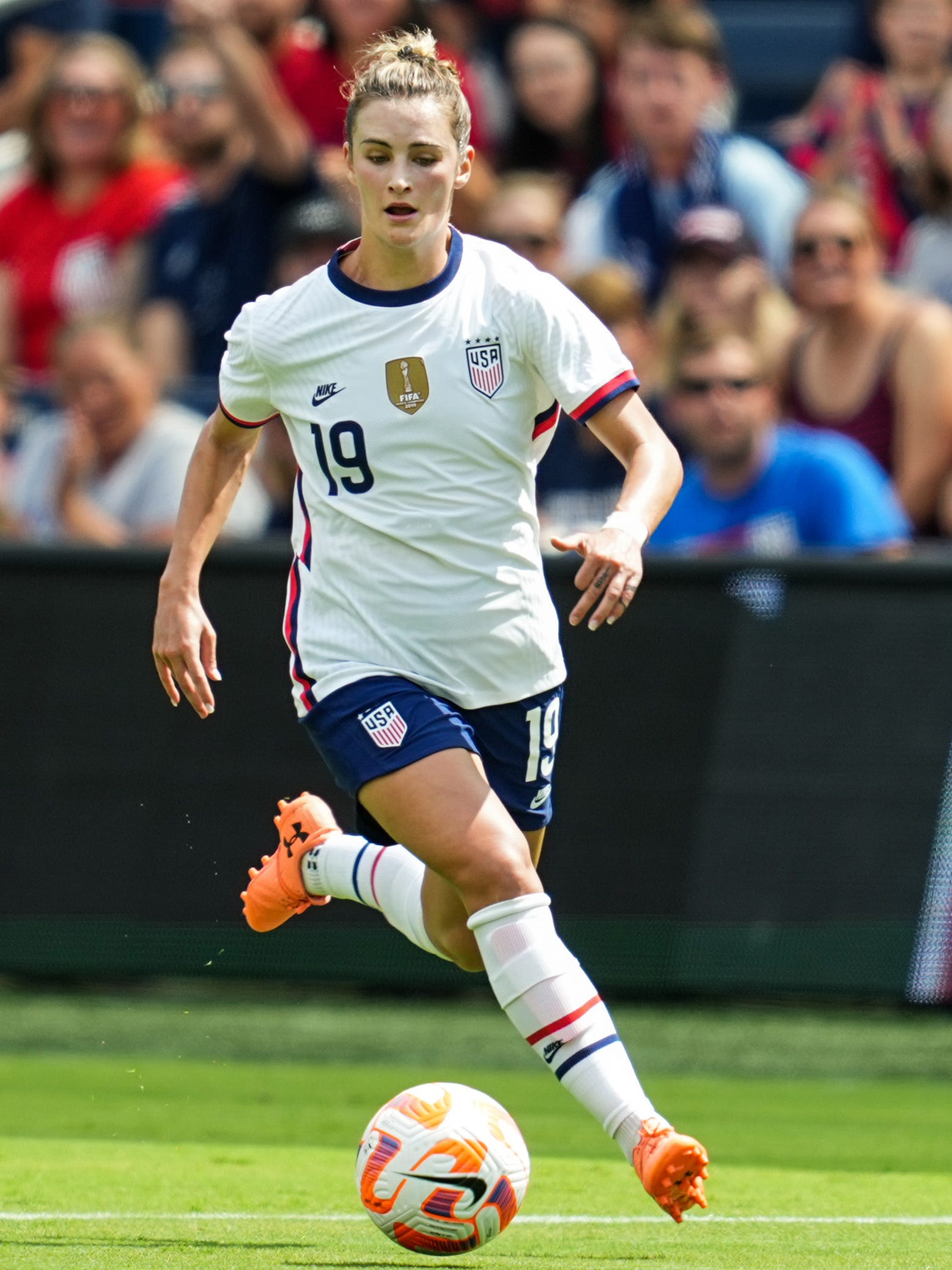 An action image of Emily Fox playing soccer.