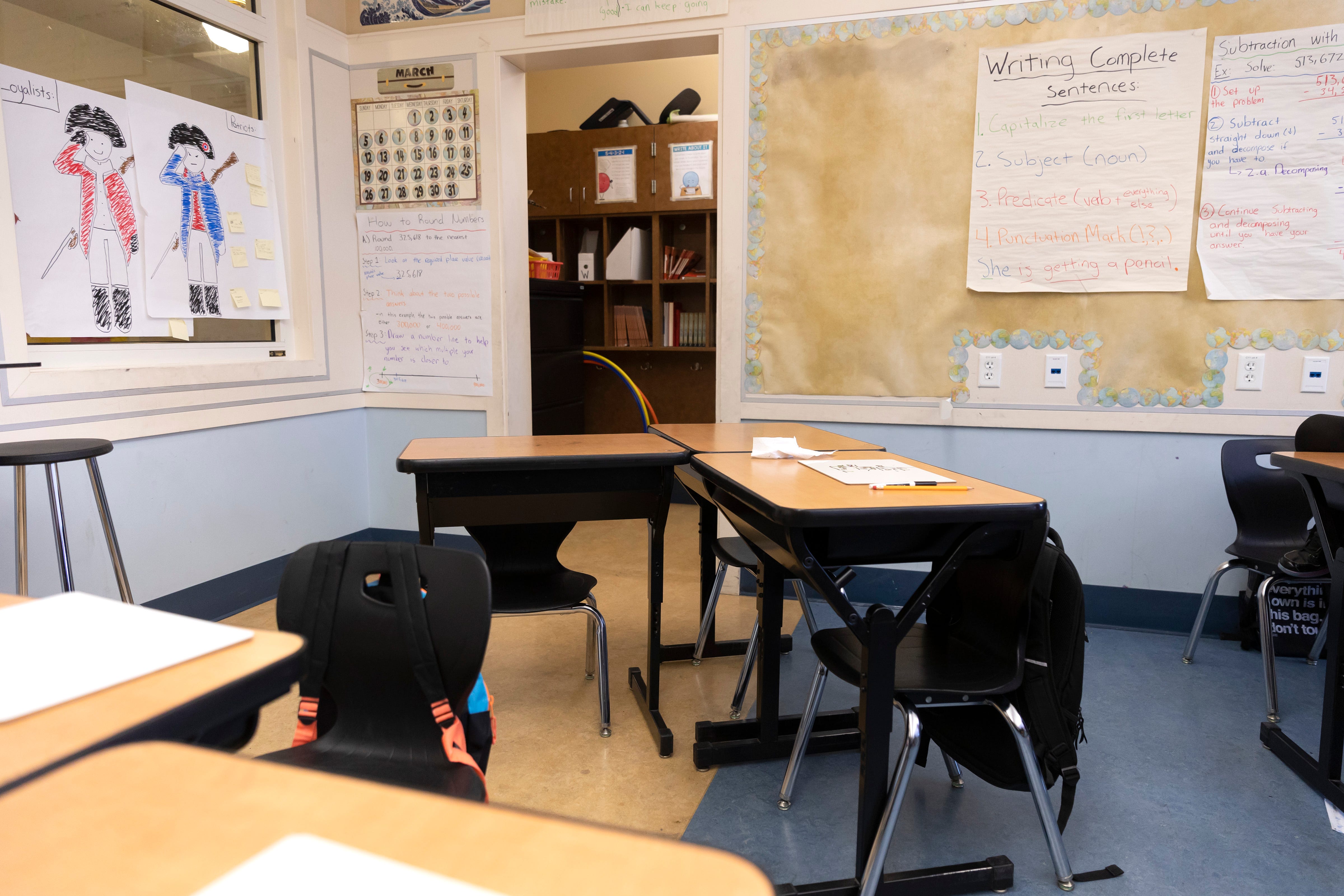 An empty desk belonging to Jayceon Davis, a student, is seen in the corner of the classroom at Nystrom Elementary in Richmond, Calif.