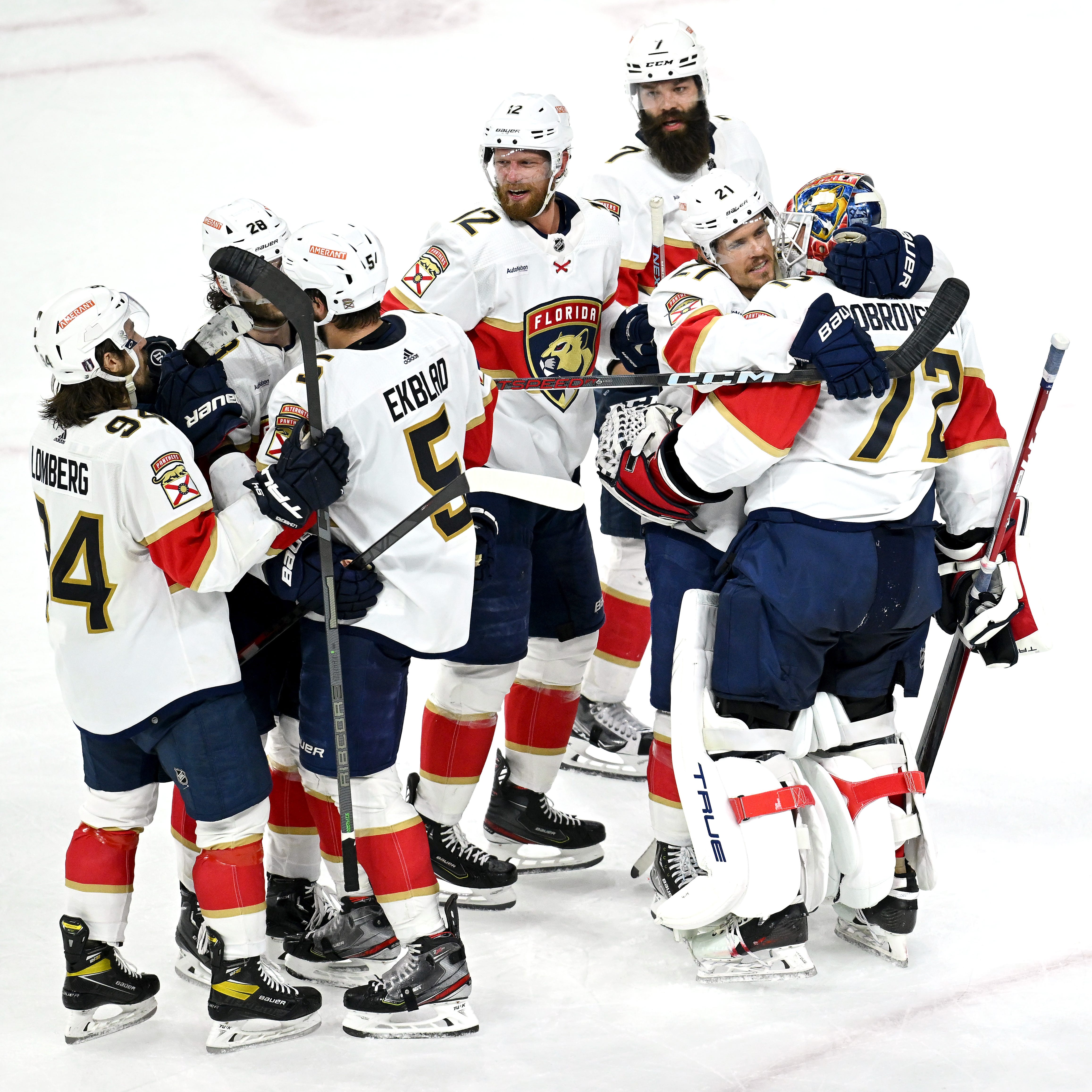 The Florida Panthers celebrate their four-overtime win against the Carolina Hurricanes.