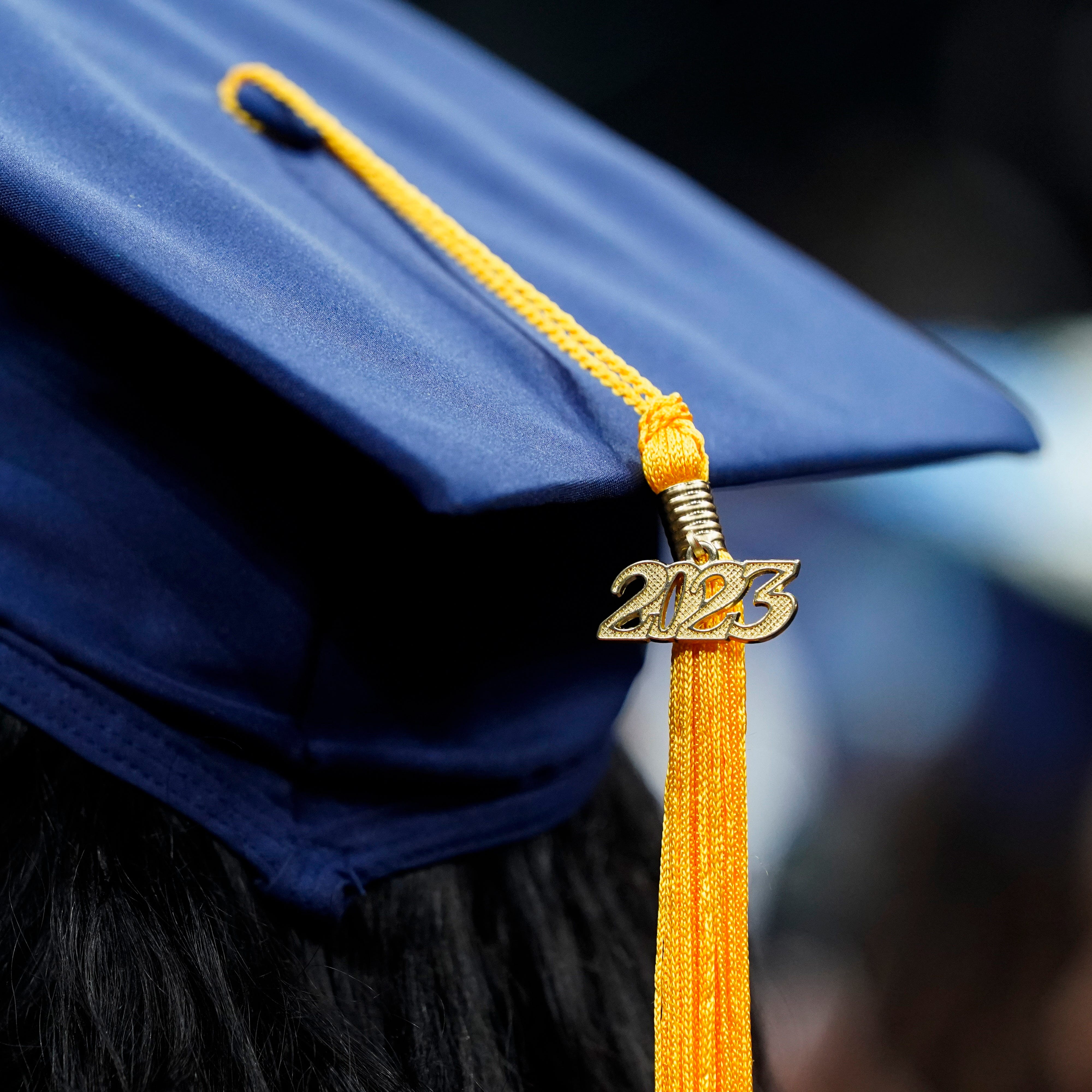 A tassel with 2023 on it rests on a graduation cap as students walk in a procession for Howard University's commencement in Washington, Saturday, May 13, 2023. (AP Photo/Alex Brandon) ORG XMIT: DCAB507