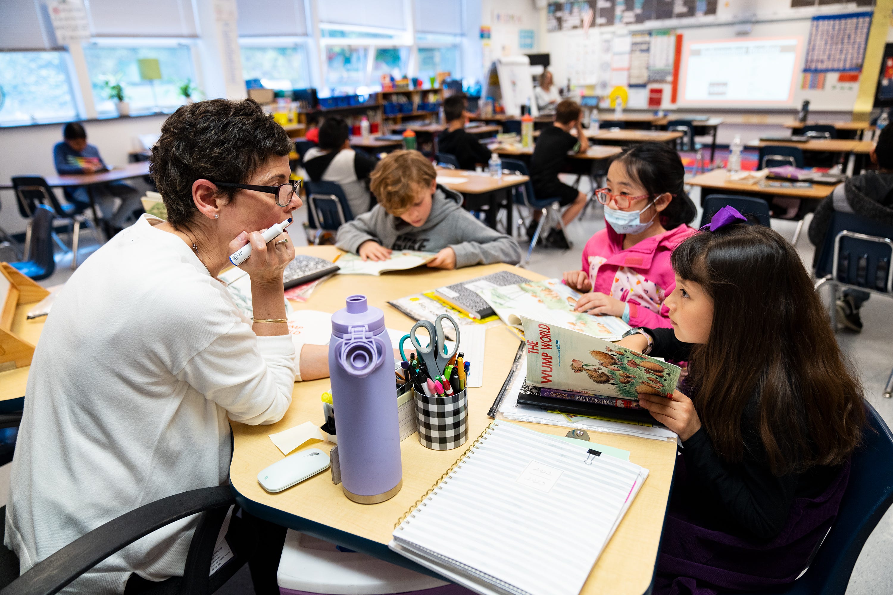 Lisa Cay, a third grade teacher at Sleepy Hollow Elementary School in Falls Church, Va., goes over a reading lesson with her students.