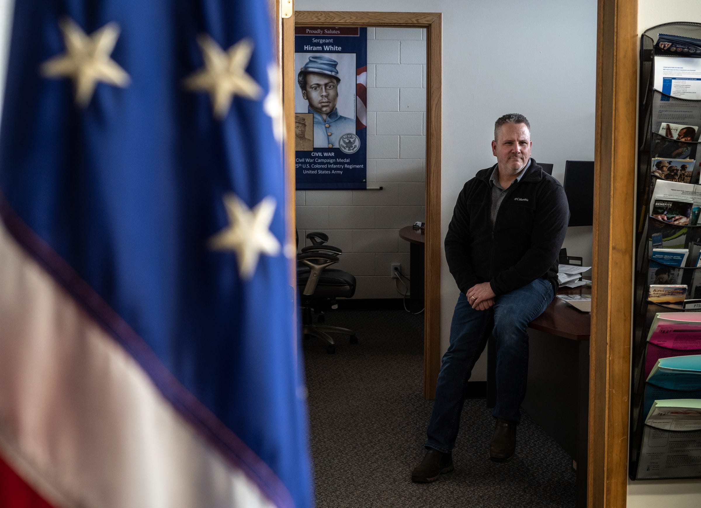 Joe Battisfore, director of the Houghton County Veterans Service Office, sits on his desk inside the Houghton County Memorial Airport on Sunday, April 23, 2023.