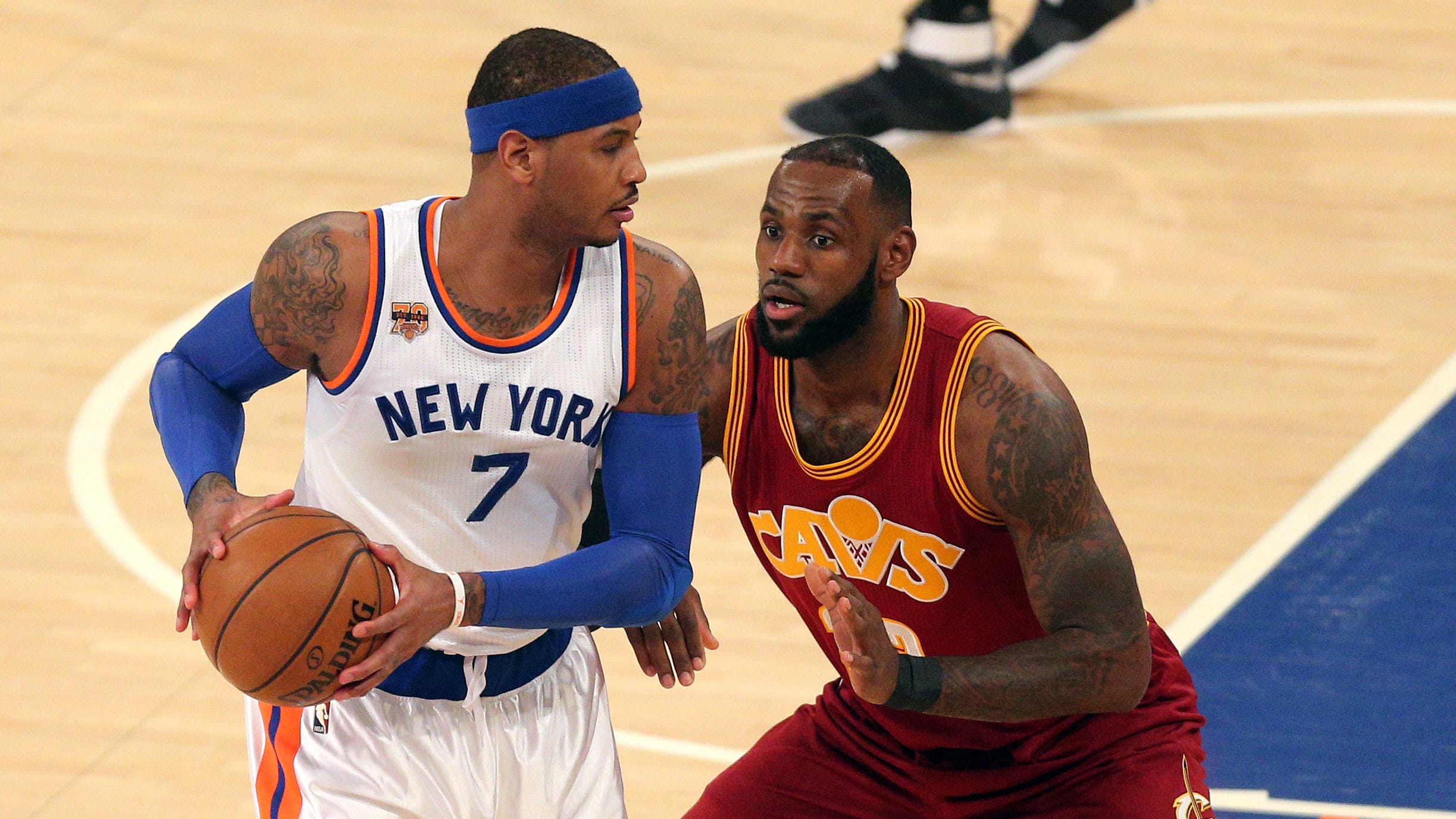 Carmelo Anthony of the New York Knicks looks to make a move on LeBron James of the Cleveland Cavaliers in a 2016 game. Anthony was selected third overall in the 2003 NBA draft, two spots behind James.