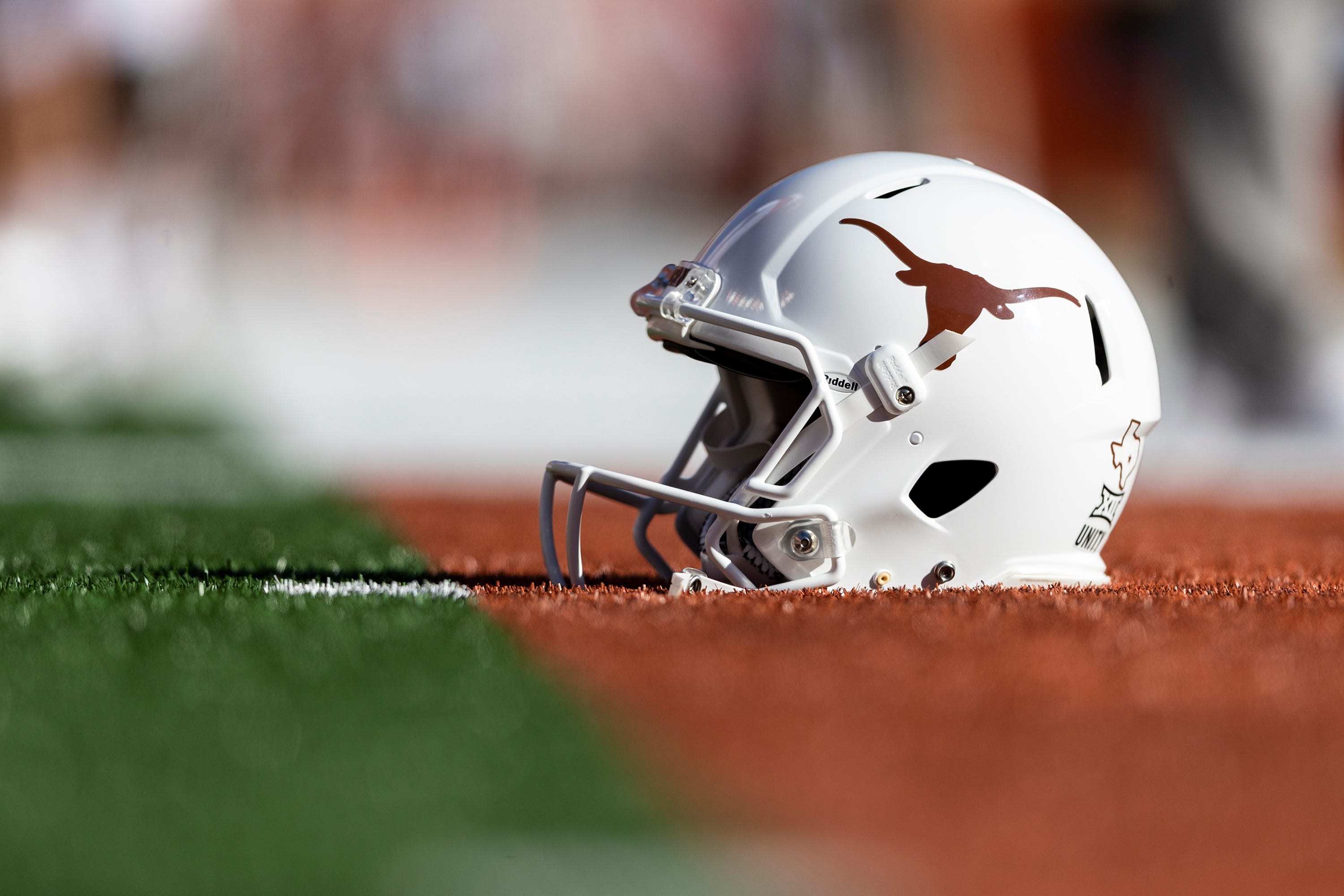 A Texas Longhorn helmet sits on the sideline before an NCAA college football game in Austin, Saturday, Oct., 16, 2021.