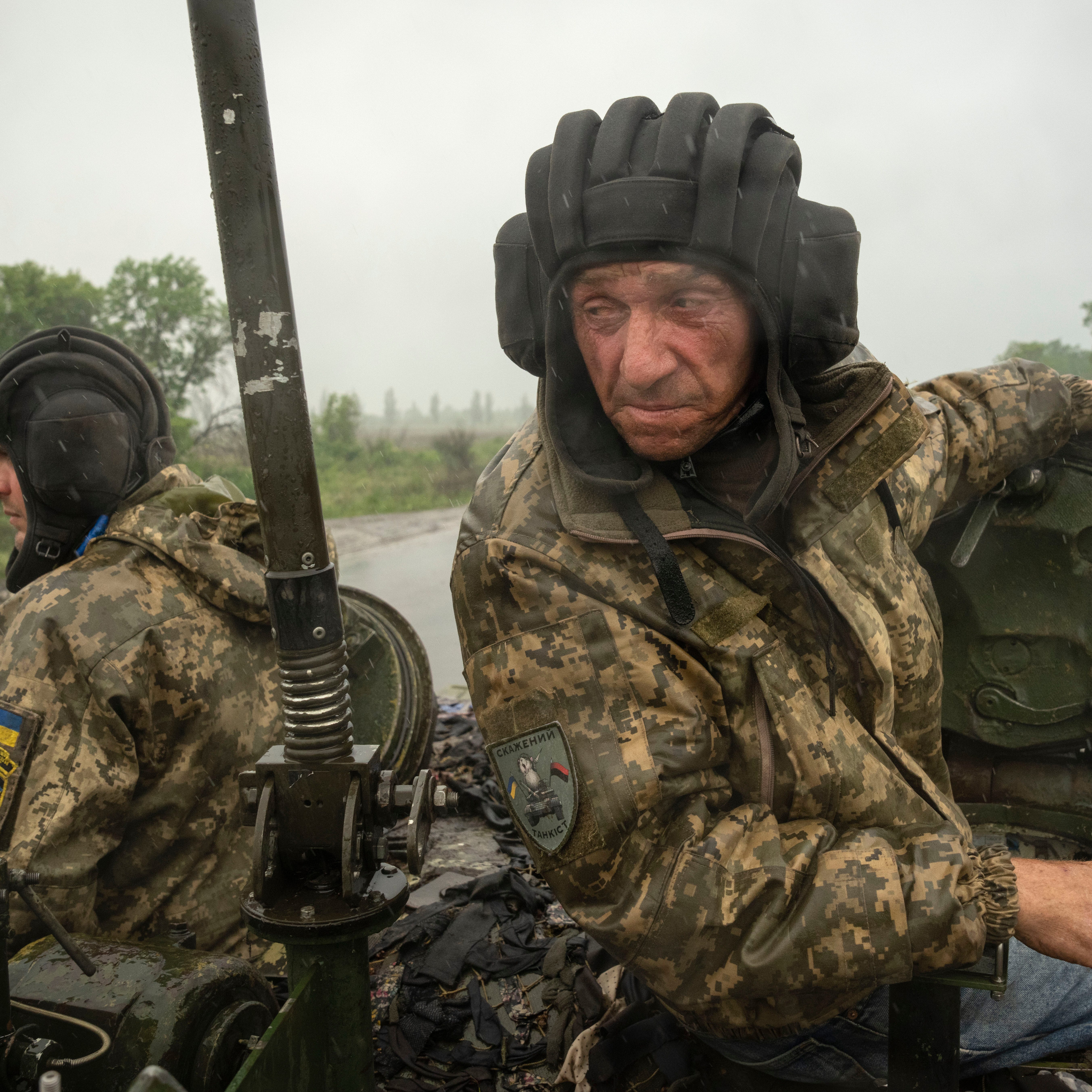 Ukrainian tankers ride along the road towards their positions near Bakhmut, Donetsk region, Ukraine, Tuesday, May 23, 2023.