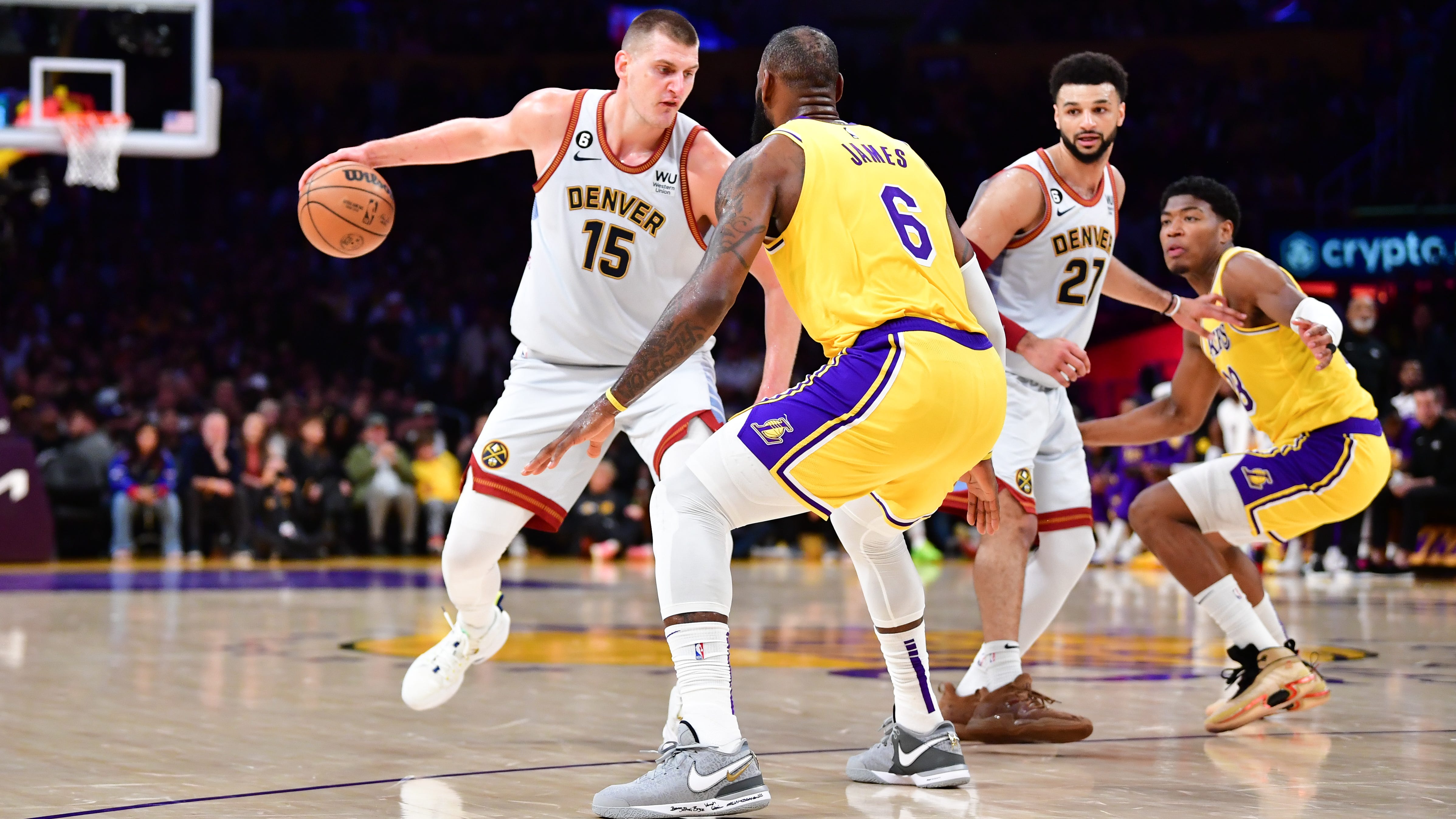 Nuggets center Nikola Jokic drives to the basket against Lakers forward LeBron James in Game 4 of the Western Conference finals.