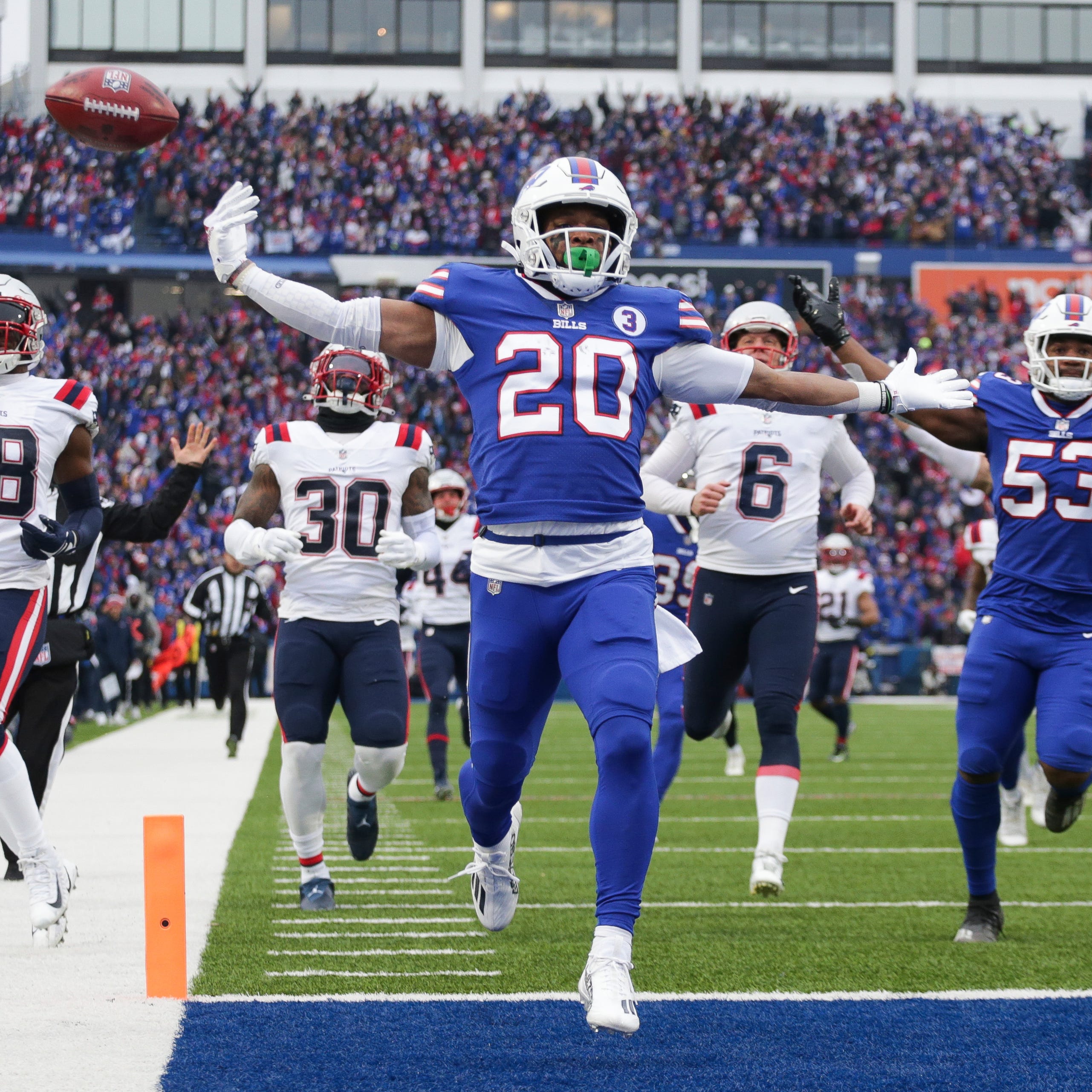 Buffalo Bills running back Nyheim Hines (20) scores a touchdown on a kickoff return during the first half of an NFL football game against the New England Patriots on Sunday, Jan. 8, 2023, in Orchard Park, N.Y.