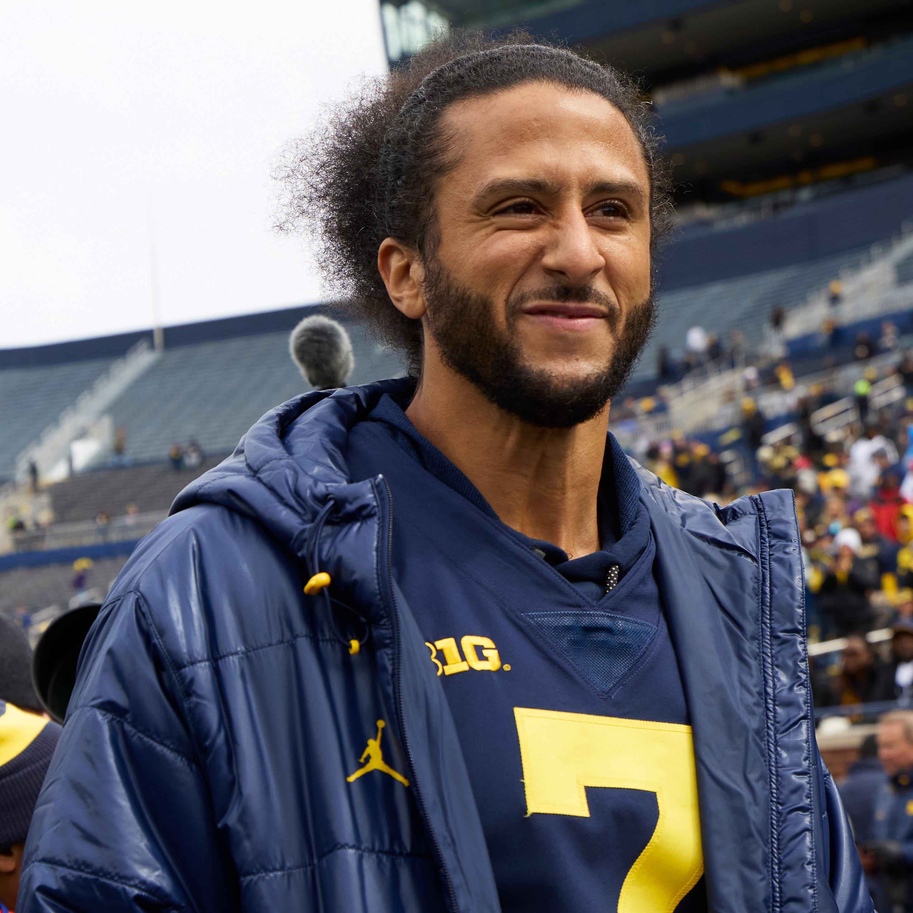 Colin Kaepernick on the sideline before the Michigan Wolverines' spring game at Michigan Stadium on April 2, 2022.