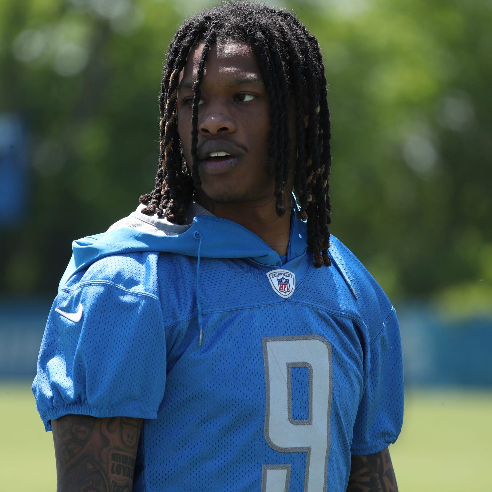 Lions wide receiver Jameson Williams walks off the field after OTAs.
