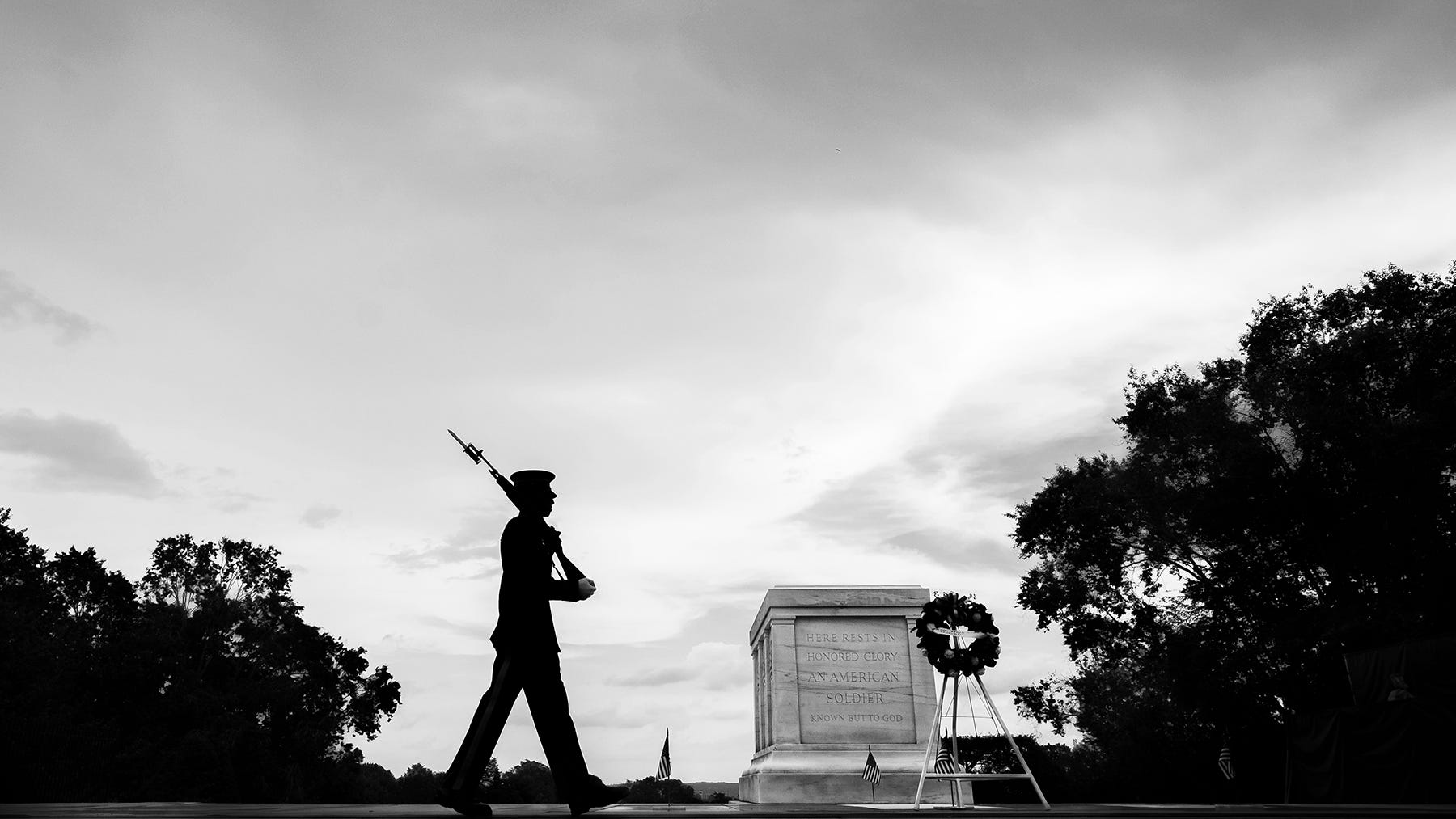 A soldier of the U.S. Army 3rd Infantry Regiment guards The Tomb of the Unknown Soldier in Arlington National Cemetery in Virginia.