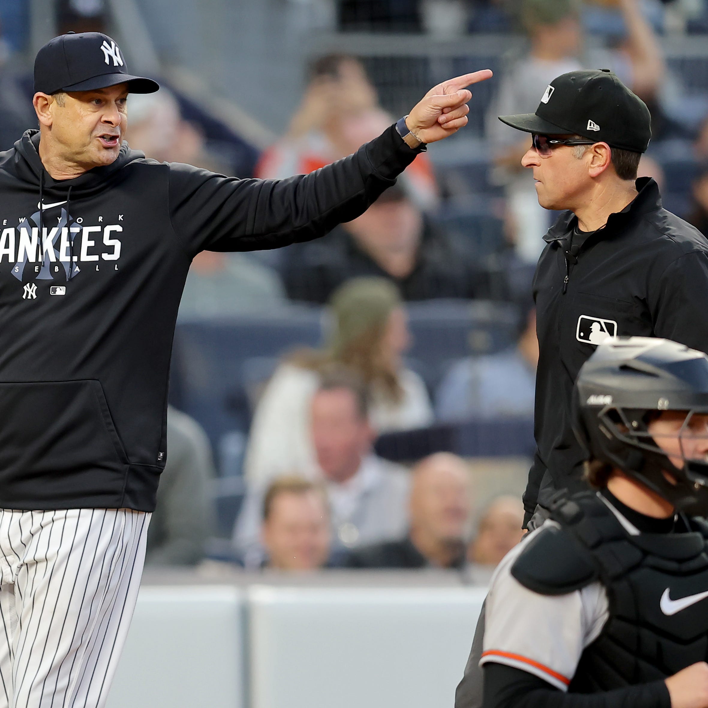 May 25, 2023; Bronx, New York, USA; New York Yankees manager Aaron Boone (17) argues with first base umpire Chris Guccione (68) during the third inning against the Baltimore Orioles at Yankee Stadium. Mandatory Credit: Brad Penner-USA TODAY Sports