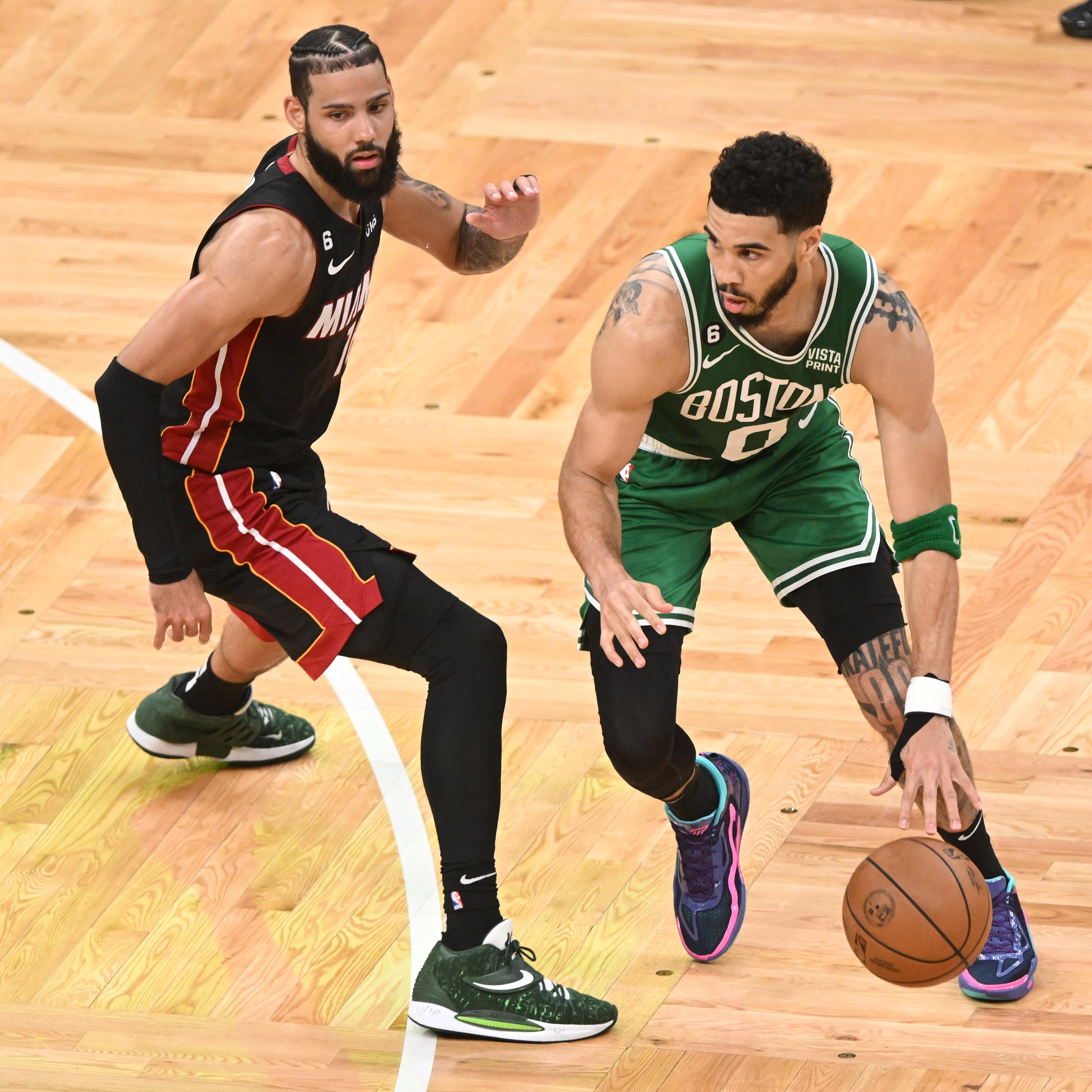 Jayson Tatum controls the ball against Caleb Martin in the second quarter of Game 5 of the Eastern Conference finals.