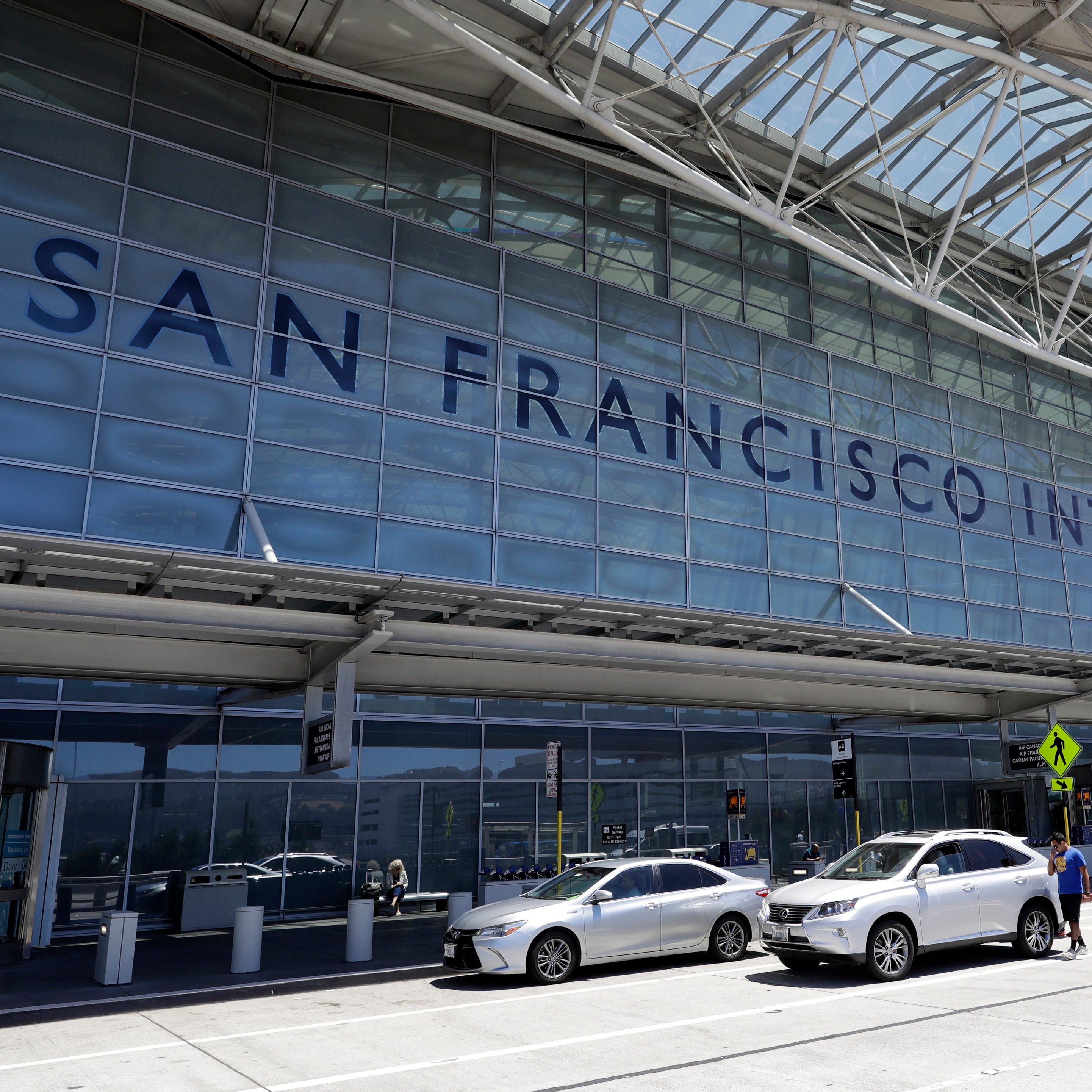 Vehicles wait outside the international terminal at San Francisco International Airport in San Francisco on July 11, 2017. Two airliners aborted landings at San Francisco International Airport on May 19, 2023, after pilots spotted a Southwest Airlines jet taxiing across runways on which the other planes had been cleared to land. The Federal Aviation Administration said Thursday, May 25, that it reviewed the matter and determined that appropriate steps were taken to ensure safety. (AP Photo/Marcio Jose   Sanchez, File)