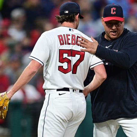 Cleveland Guardians manager Terry Francona, right, pats starting pitcher Shane Bieber on the back after removing him from the baseball game against the St. Louis Cardinals during the seventh inning Friday, May 26, 2023, in Cleveland. (AP Photo/David Dermer)