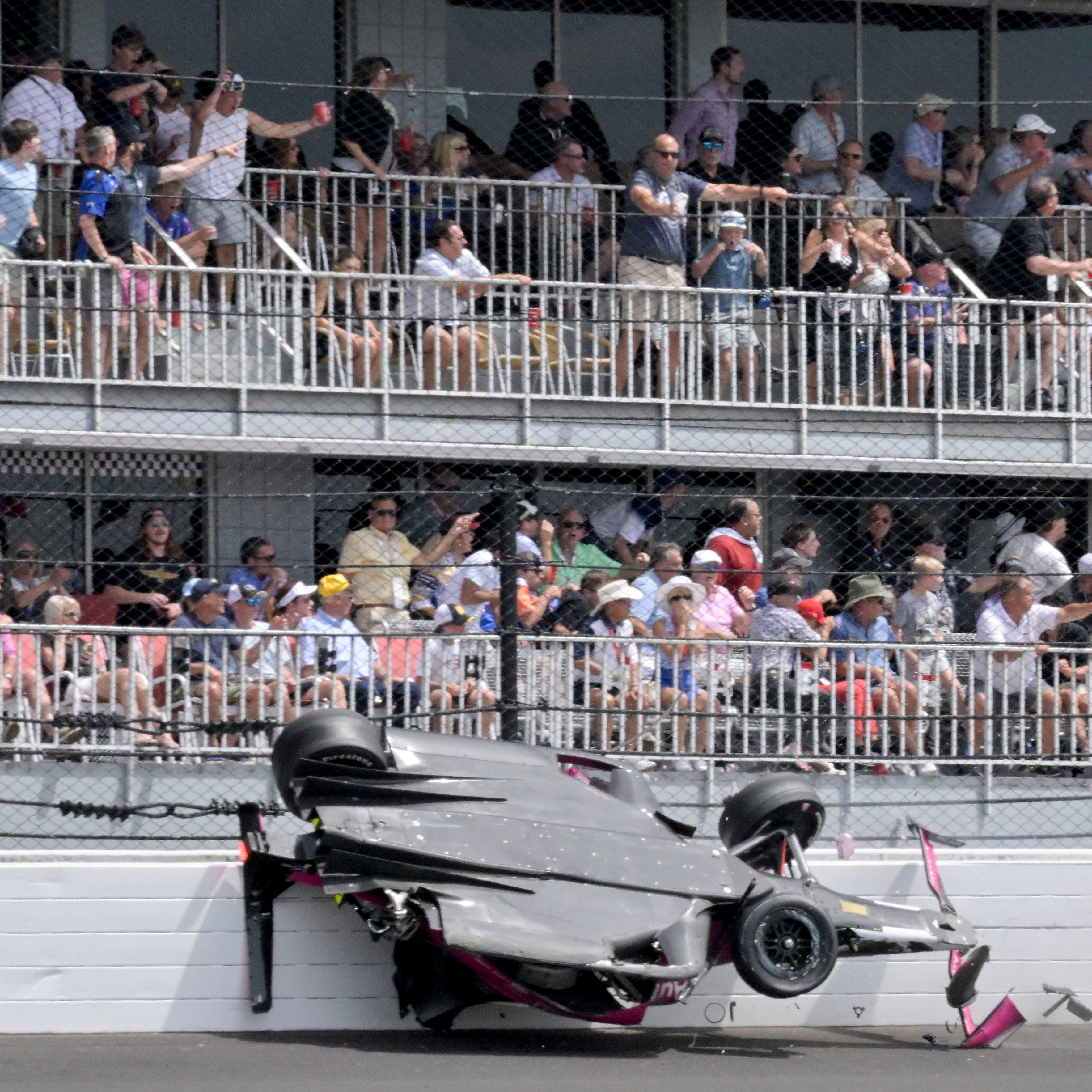 Andretti Autosport driver Kyle Kirkwood (27) slides across the SAFER barrier through the second turn after a crash with Arrow McLaren SP driver Felix Rosenqvist (not pictured) during the 107th running of the Indianapolis 500 at Indianapolis Motor Speedway.