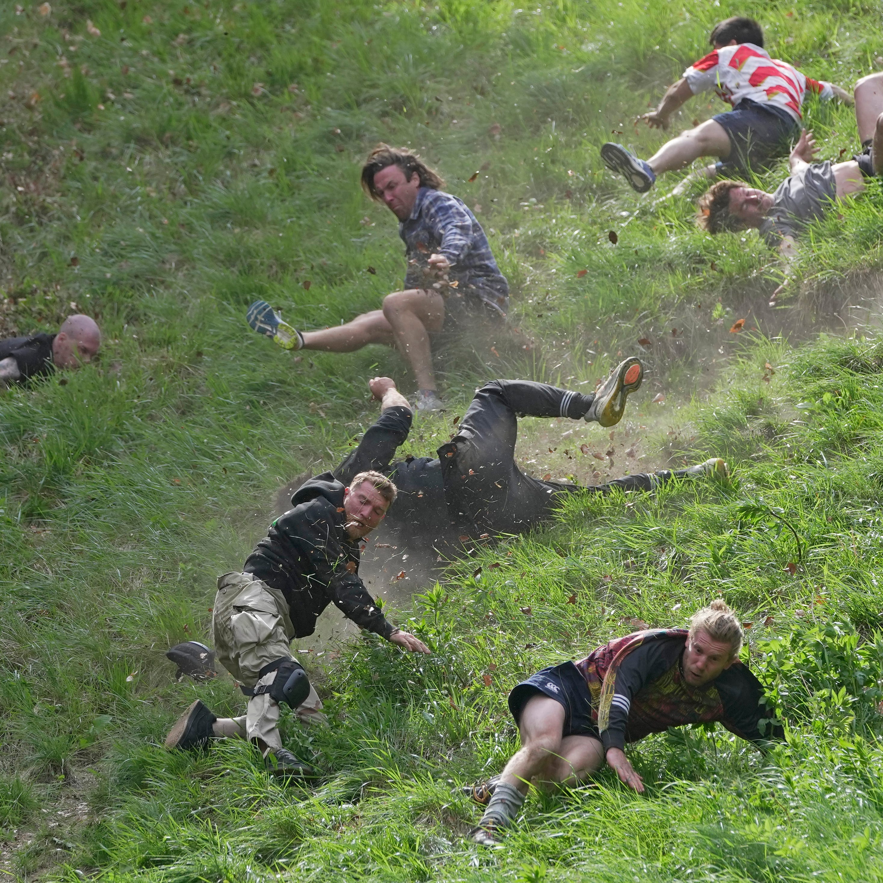 May 29, 2023: Participants compete in the men's downhill race during the Cheese Rolling contest at Cooper's Hill in Brockworth, Gloucestershire. The Cooper's Hill Cheese-Rolling and Wake is an annual event where participants race down the 200-yard (180 m) long hill chasing a wheel of double gloucester cheese.