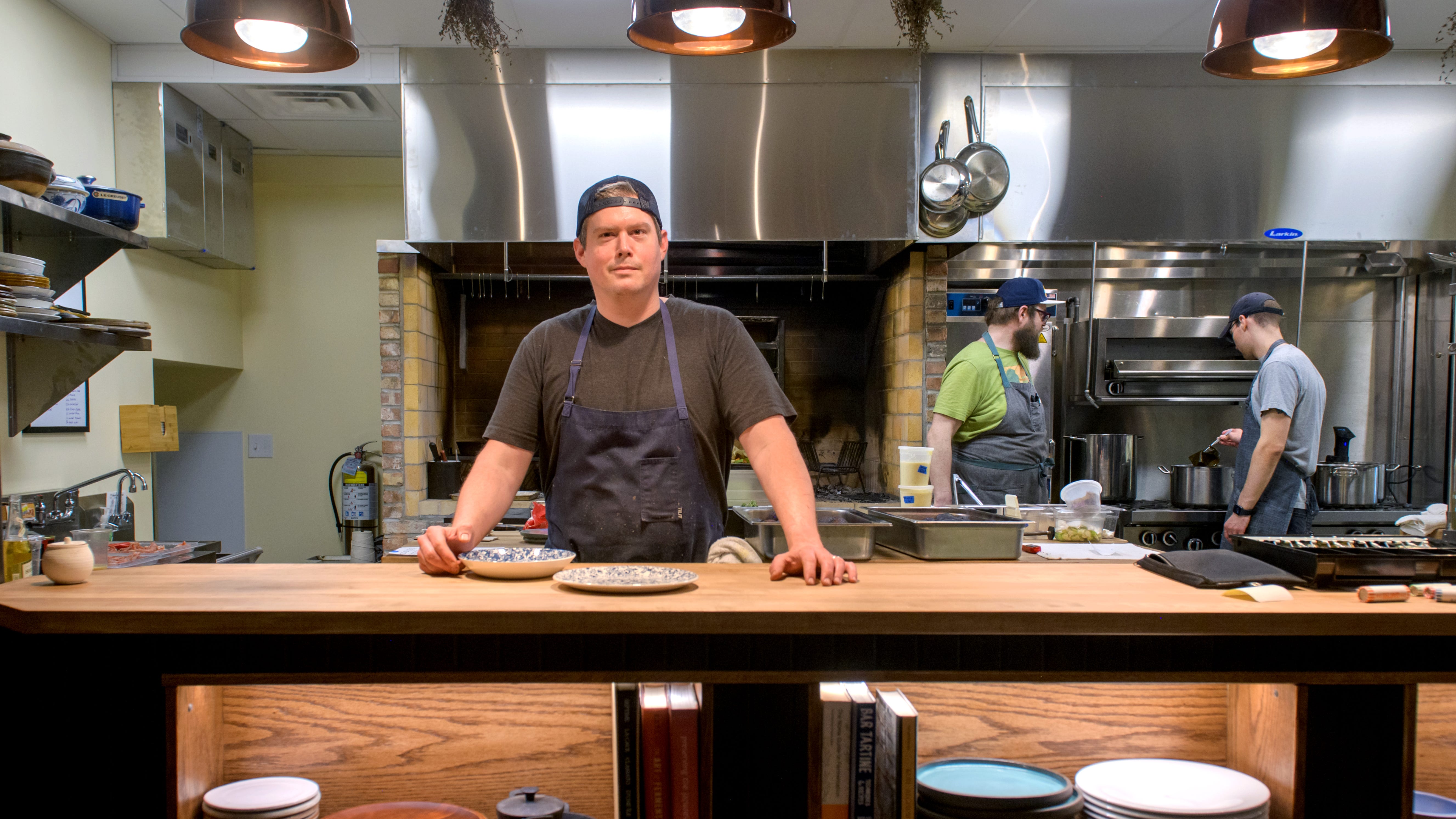 Cody Scogin, owner of Ardor Breads and Provisions at 301 W. Water Street on the Peoria riverfront, stands in the new kitchen area of his expanded bakery and restaurant space. The popular eatery has taken over the space formerly occupied by Nailon's Plumbing and Supplies and expanded from a small bakery to a full-fledged restaurant.