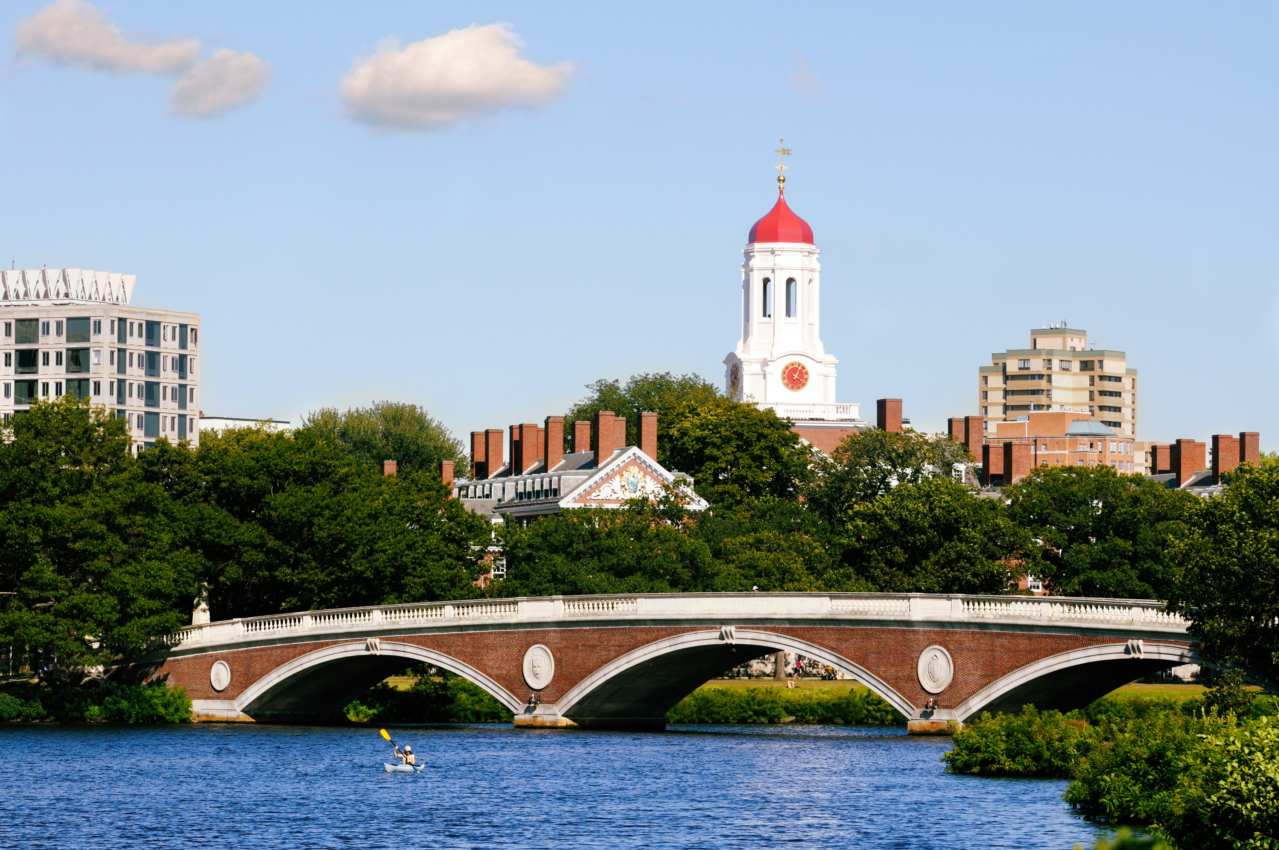 Harvard University and pedestrian bridge on Charles River in Cambridge, Massachusetts.