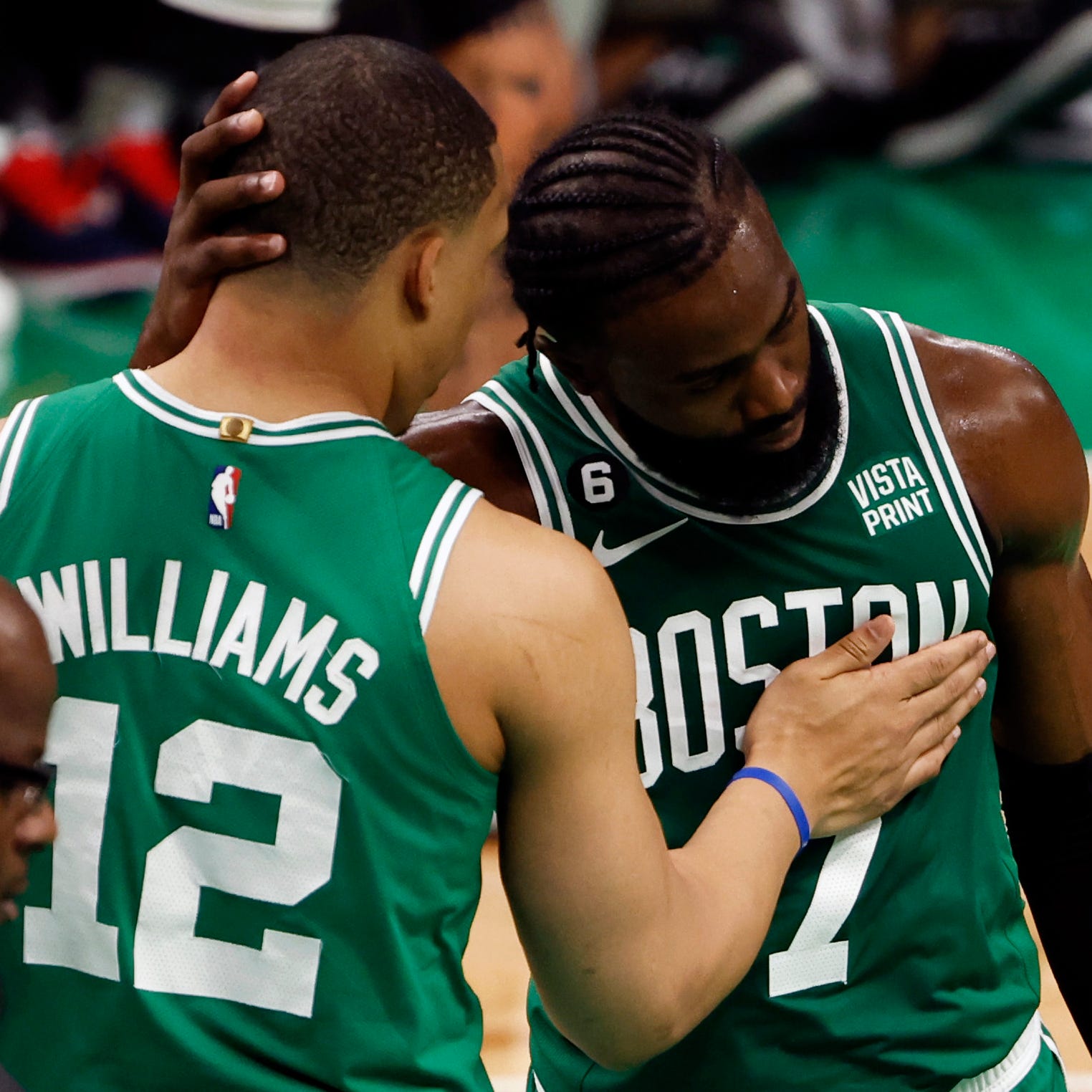 The Boston Celtics' Jaylen Brown and Grant Williams embrace during the fourth quarter of Game 7 against the Miami Heat.