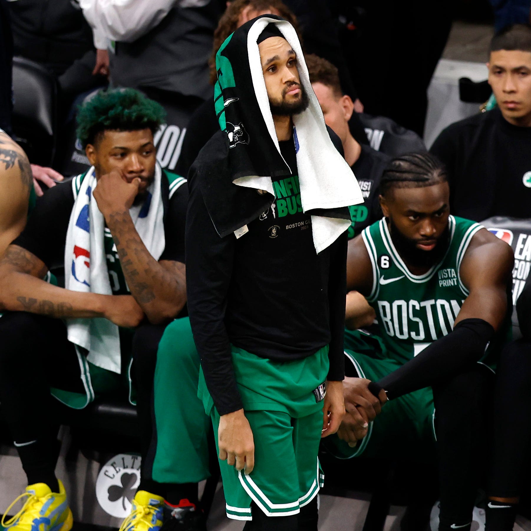 Derrick White and the Boston Celtics bench watches the final seconds of their Game 7 loss to the Miami Heat.