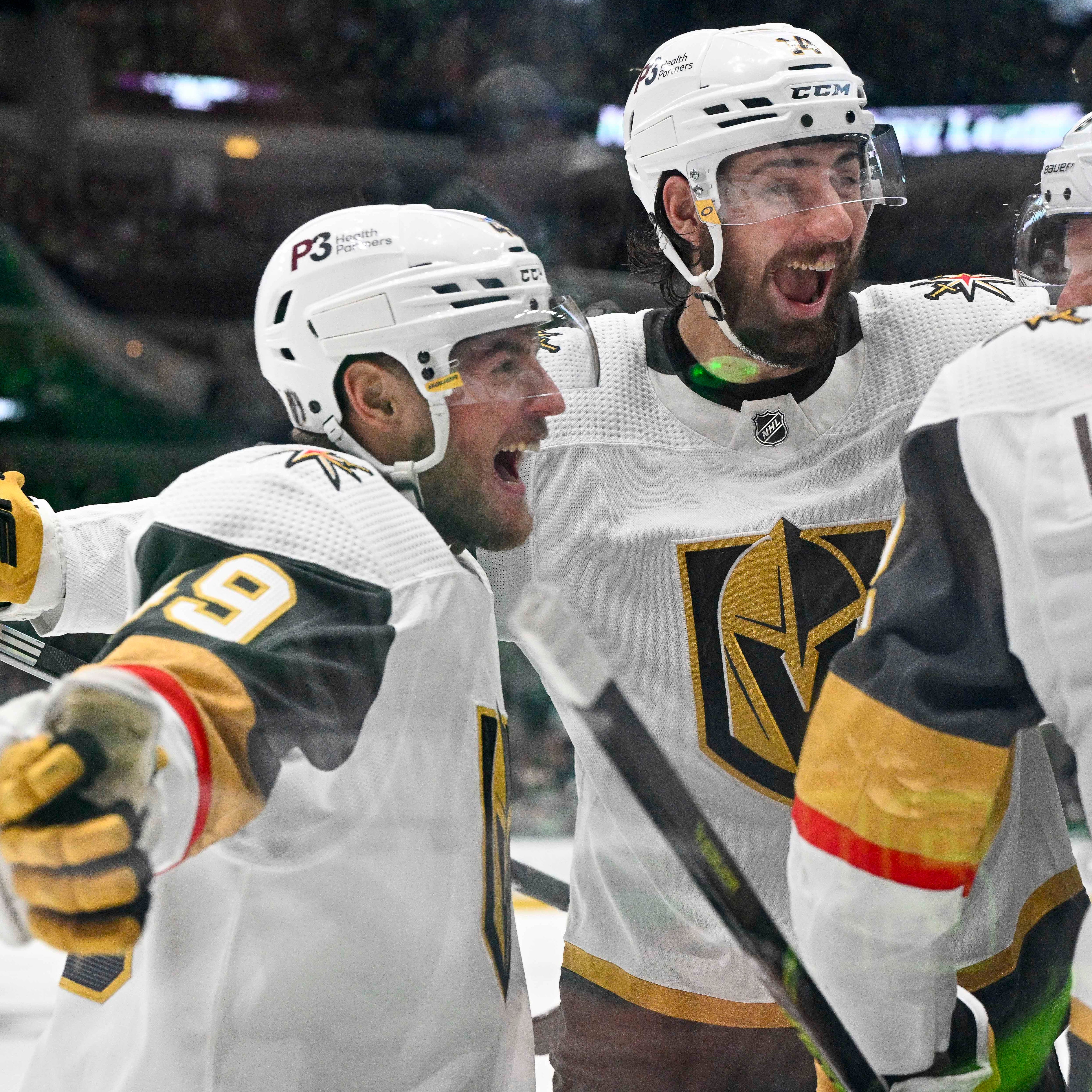 The Vegas Golden Knights' Ivan Barbashev (49), Nicolas Hague (14) and Zach Whitecloud (2) celebrates a goal scored by Jonathan Marchessault against the Dallas Stars during the Game 6 at American Airlines Center.