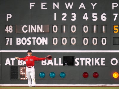 Reds players explore, sign the Green Monster before game at Fenway Park