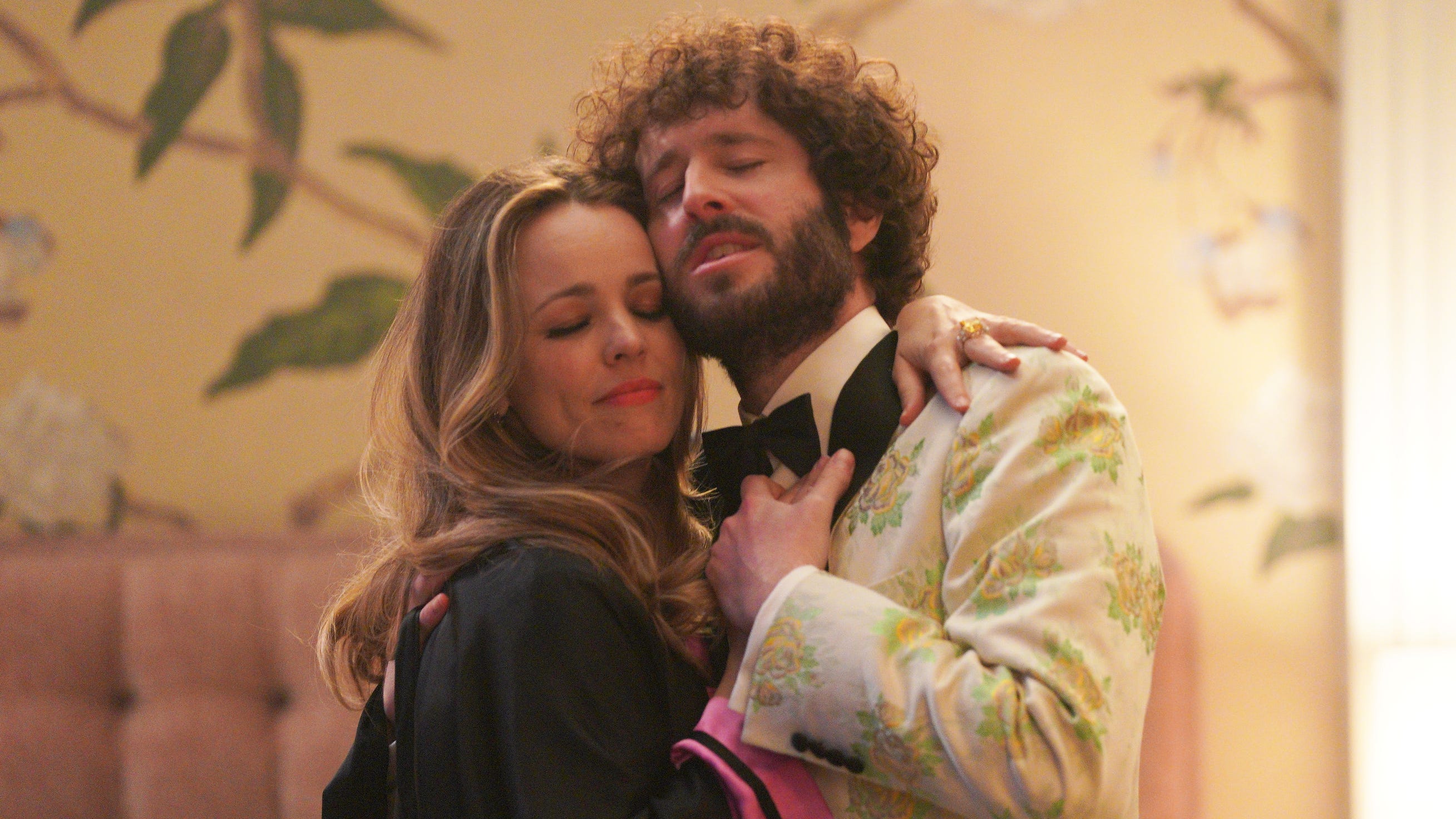"Dave" co-creator and star David Burd appears with Rachel McAdams in a music video shoot for his character's song.